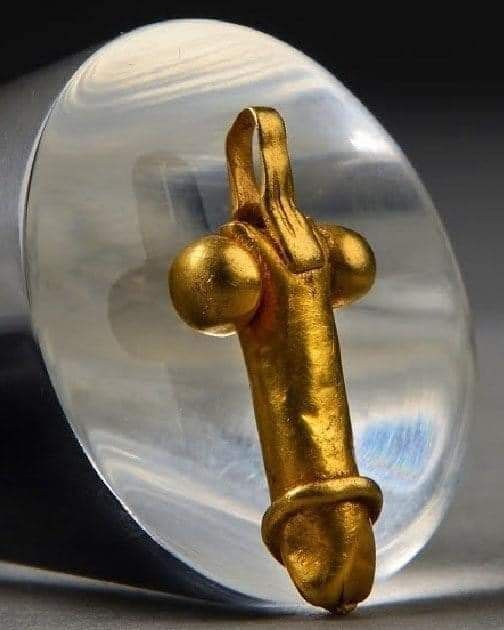 Gold Romano-British pendant in the shape of a phallus. Lynn Museum, Norfolk Museums Collections.