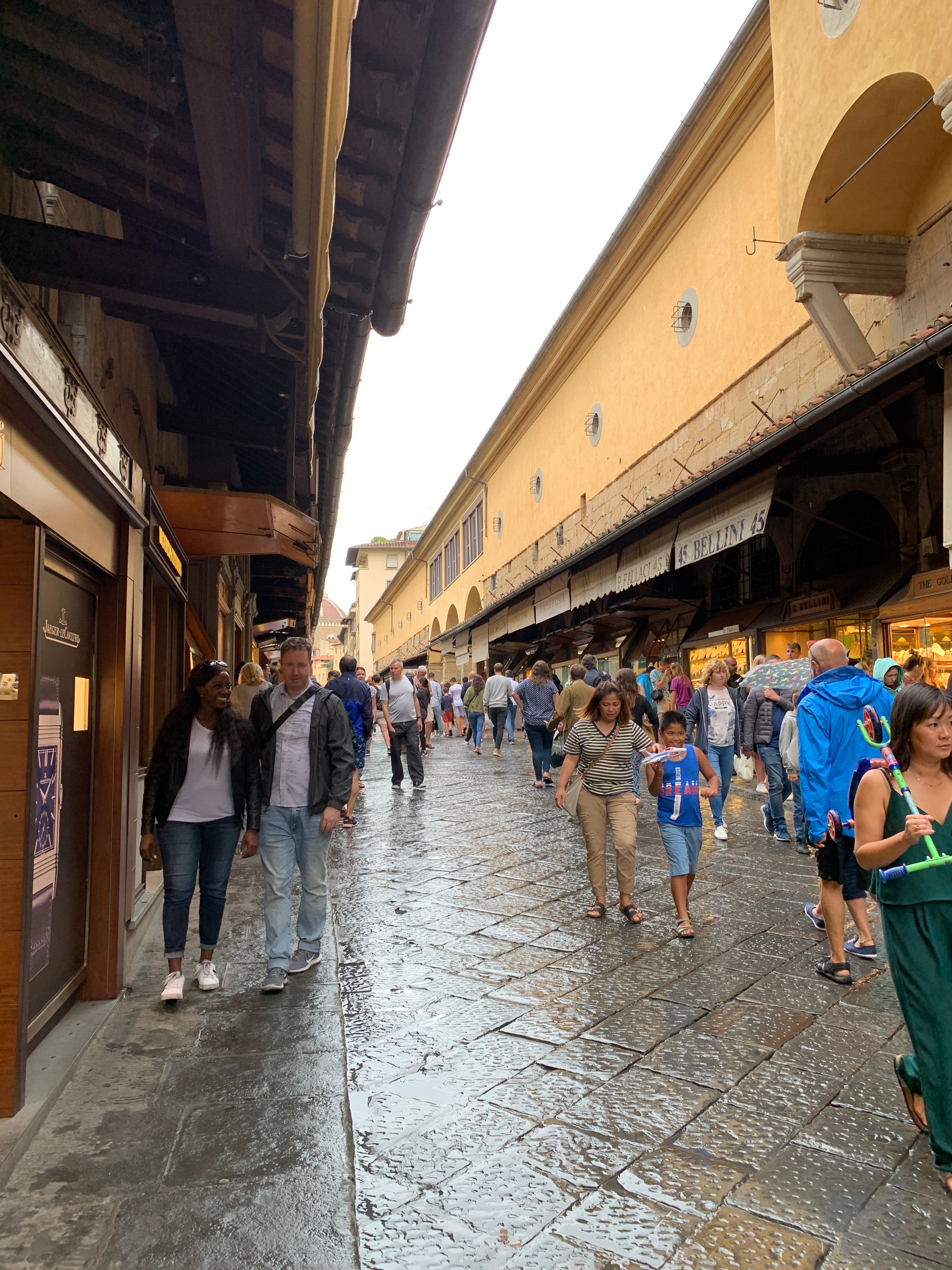 Tourists (like me!) shopping for souvenirs on the Ponte Vecchio, Florence, 2019. 