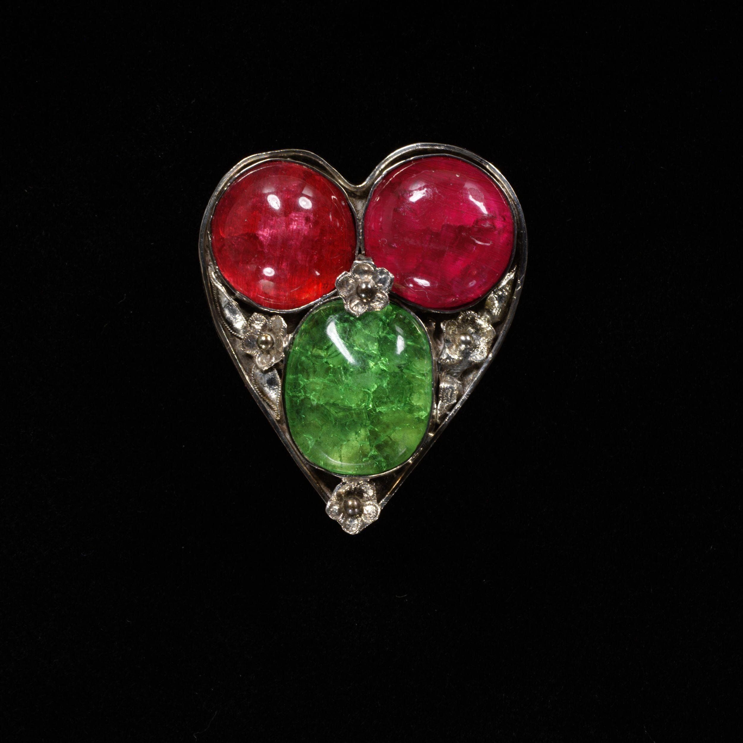 This paste-set heart brooch was given to Jane Morris (wife of William Morris) by Dante Gabriel Rossetti. She was often painted by Rossetti, who was known to visit curiosity shops in London to hunt for exotic jewelry and accessories for his paintings. The Victoria & Albert Museum.