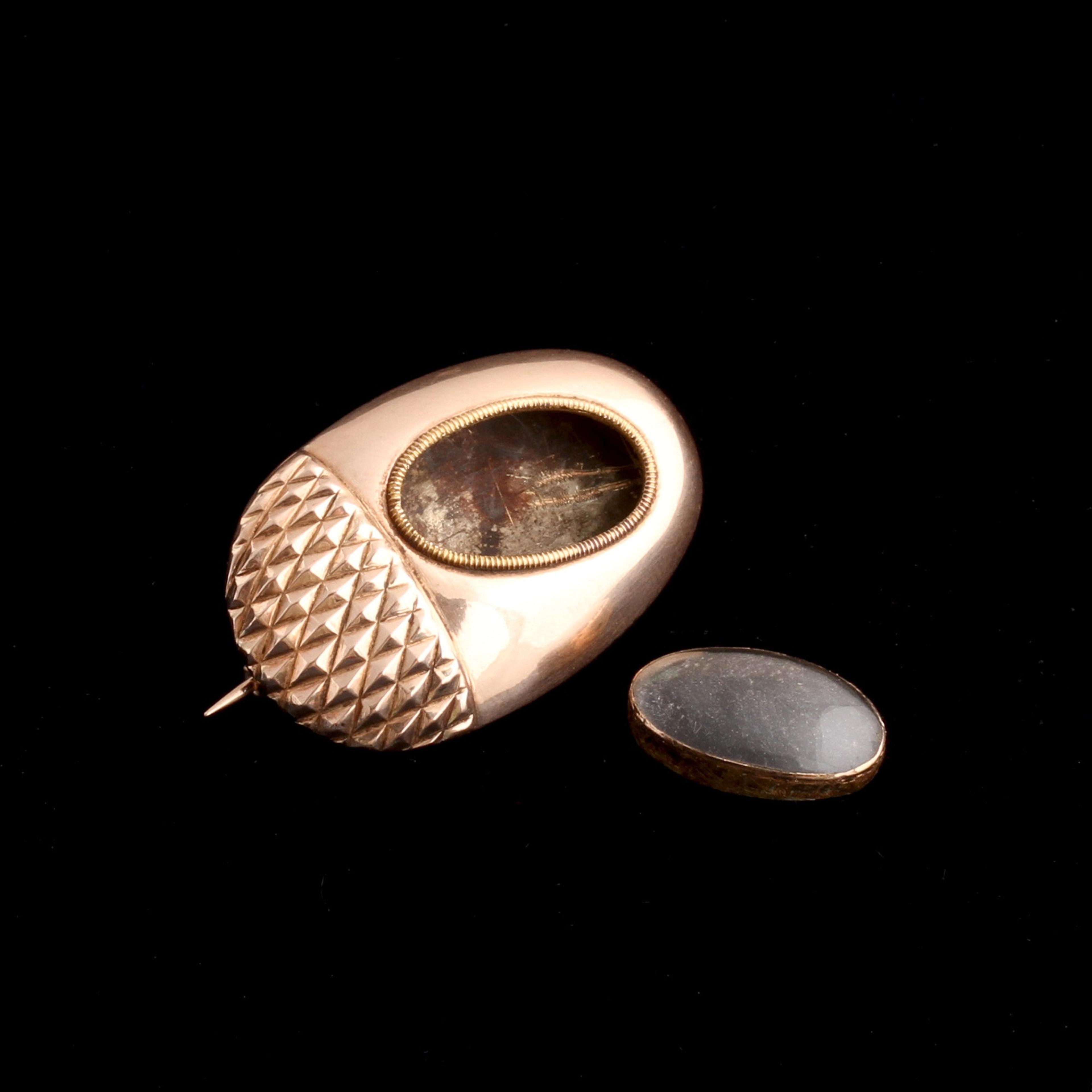 Detail of Early Victorian Acorn Locket Brooch with locket glass removed