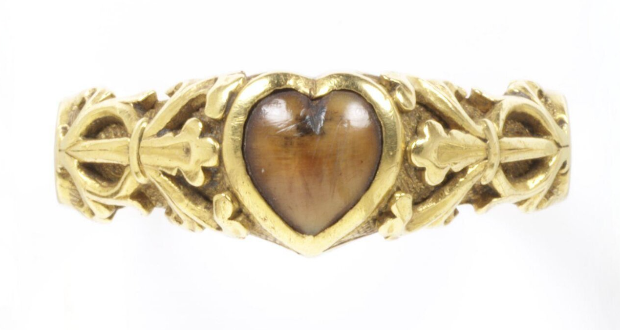A wolf-tooth set in a heart-shaped bezel. The ring is inscribed with a magical charm to protect against toothache: "Buro + Berto + Berneto" as well as the words "Cosummatum + Est" - the last words Christ was said to have spoken on the cross and were used as a charm to calm storms. c. 14th century, The Victoria & Albert Museum. 