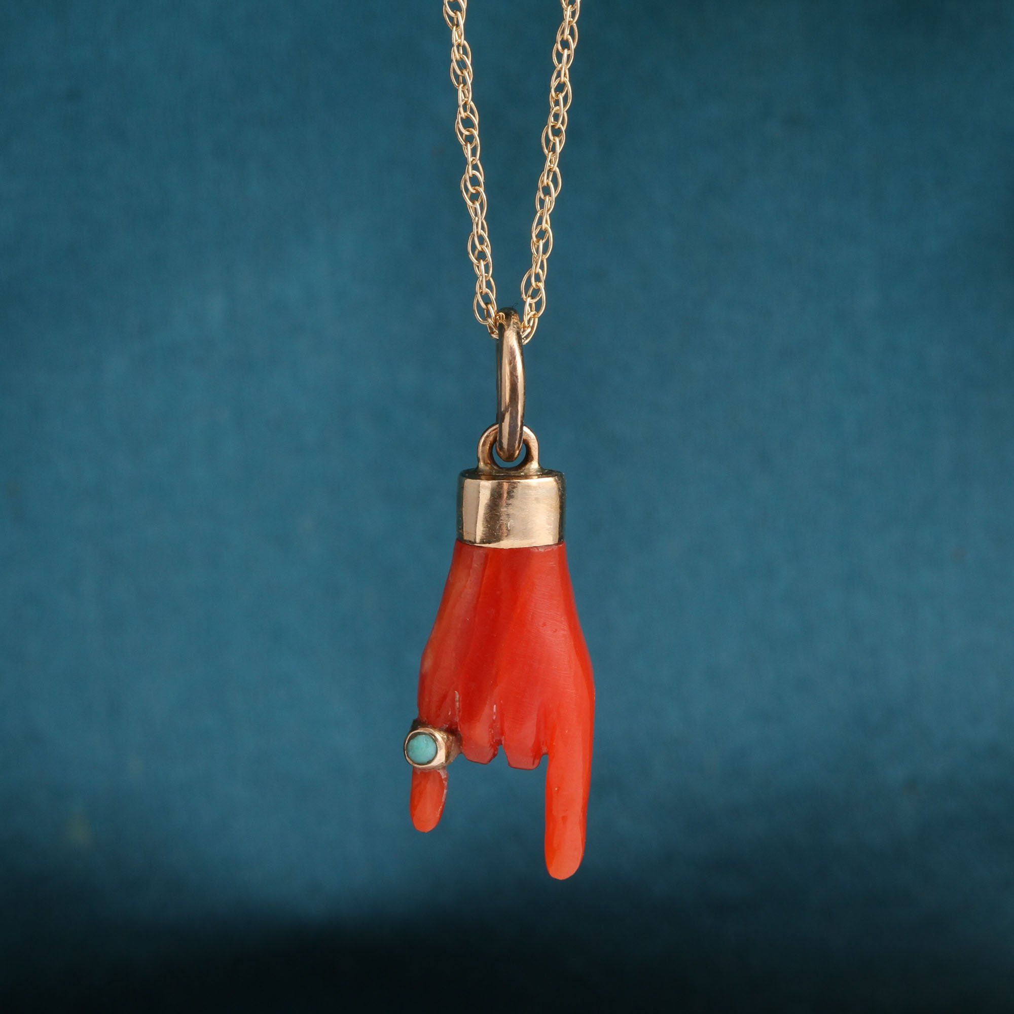 Detail of Coral Mano Cornuto with Pinky Ring Necklace