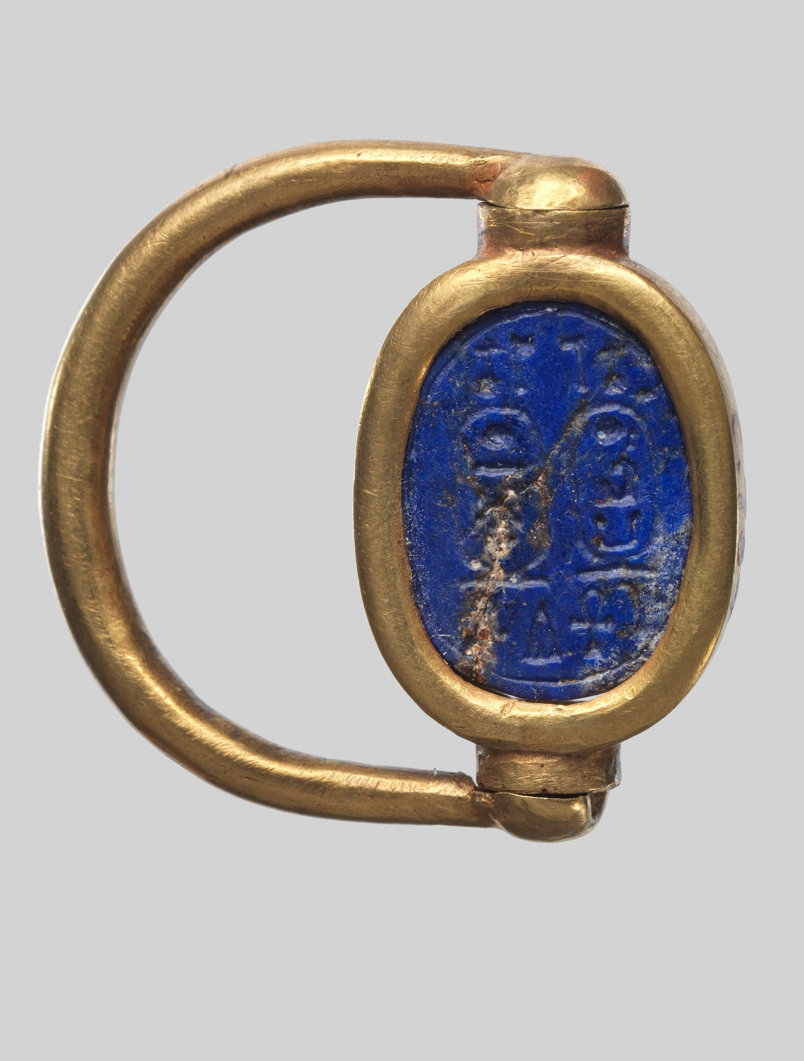 Scarab ring reverse showing the underside seal. It could be impressed onto mud sealings that sealed documents or the contents of bags and chests. Metropolitan Museum of Art. 
