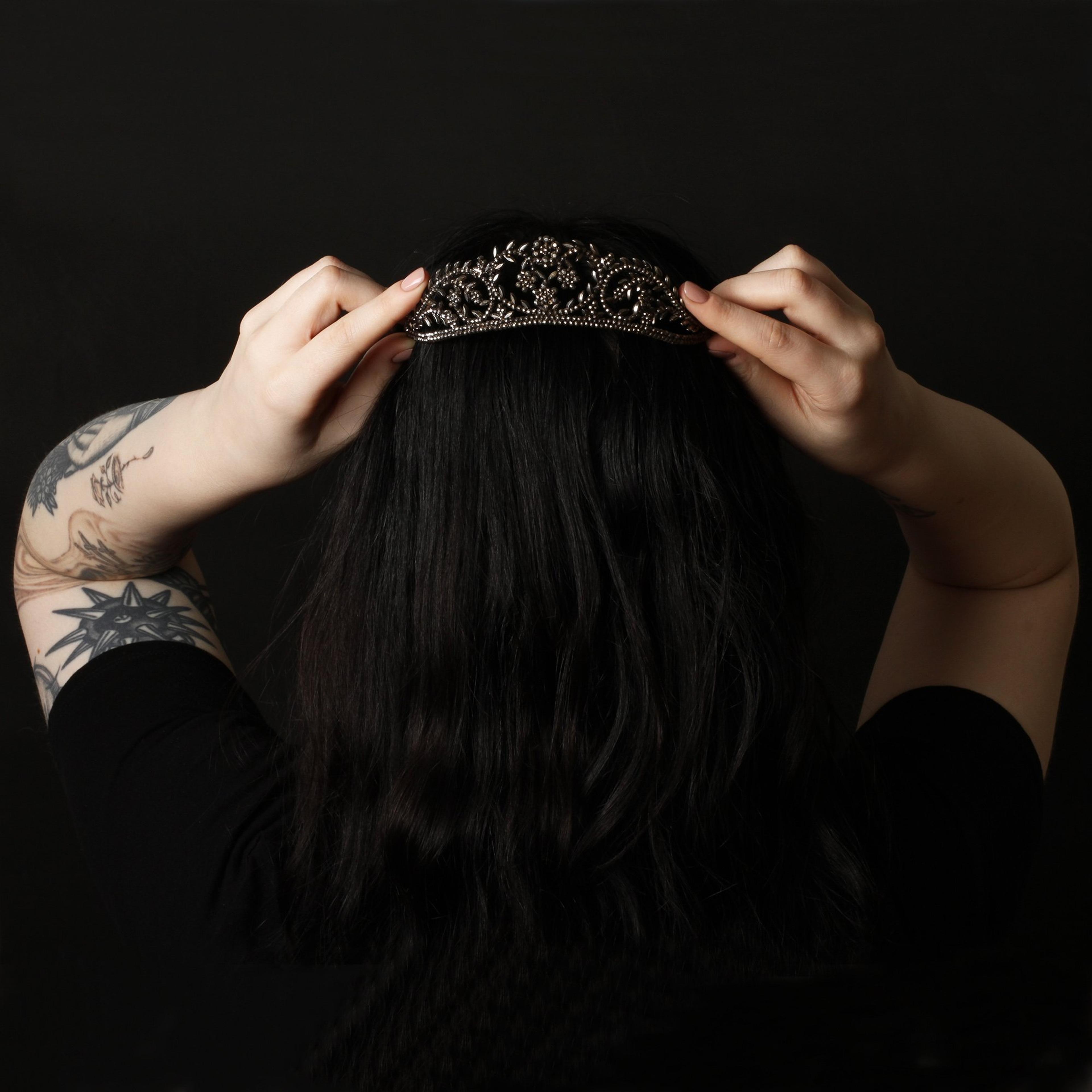 Closeup of someone wearing the Georgian Cut Steel Tiara