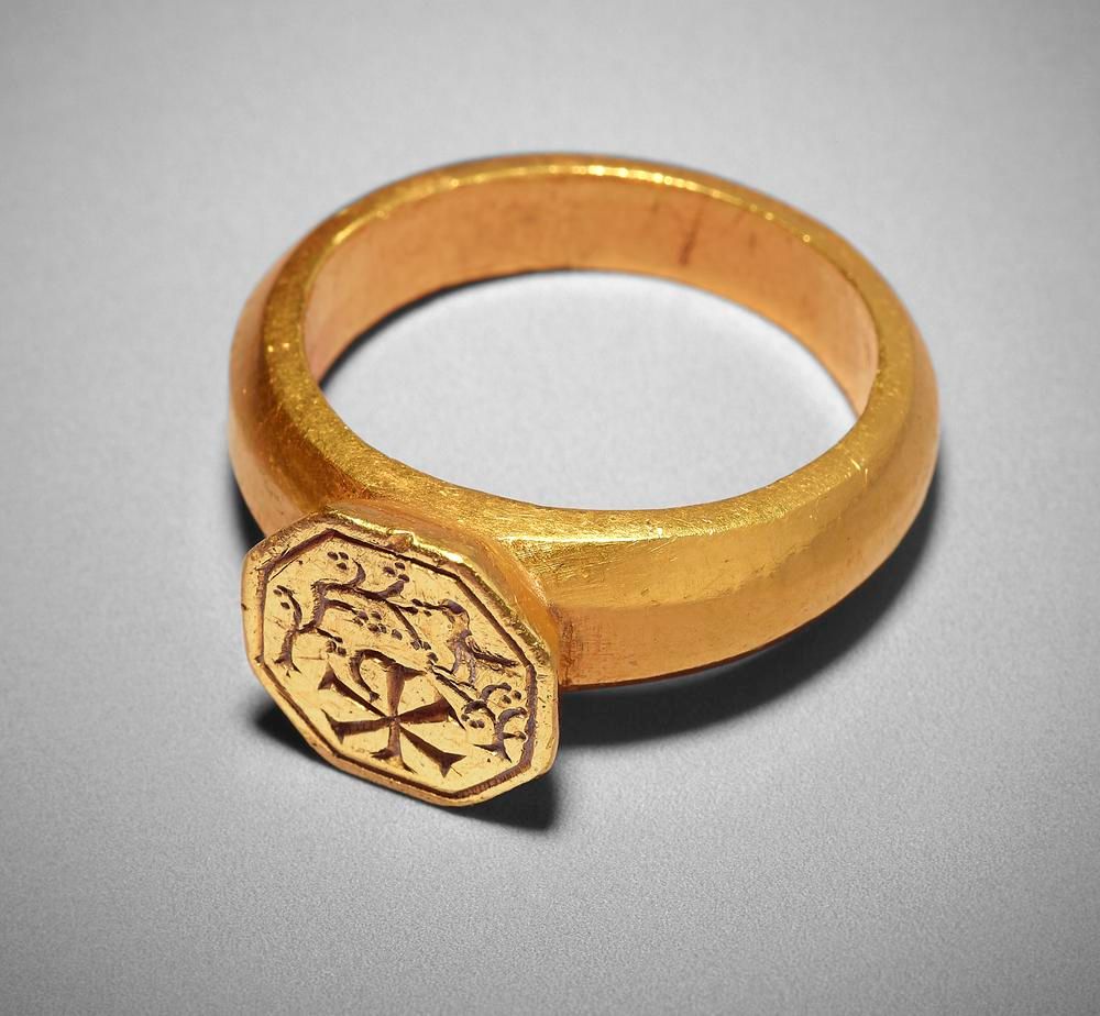This 4th century ring bears the chi-rho monogram to indicate that its wearer was a Christian.Gold ring with raised octagonal bezel,  The British Museum.  