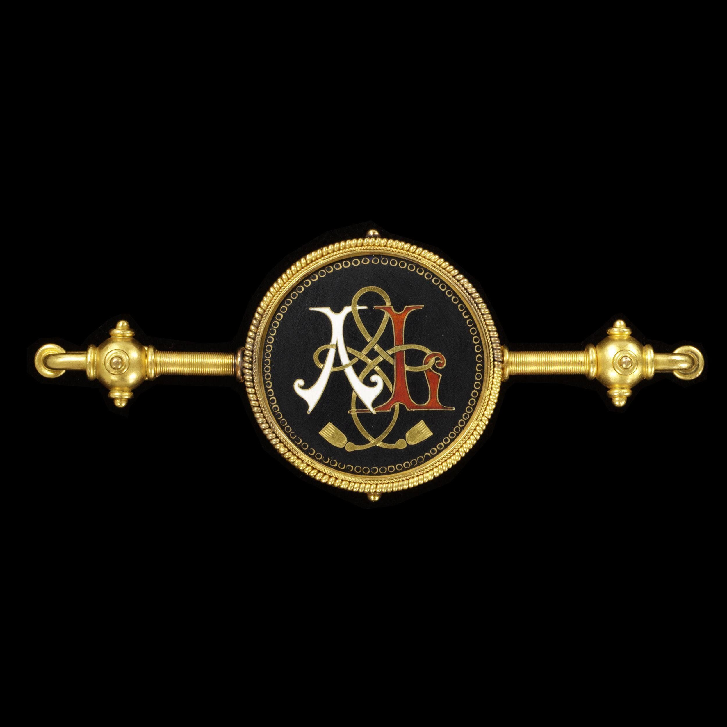 Brooch monogrammed with ‘A’ and ‘L.’ It has a compartment on the reverse containing a lock of hair. It was given to Queen Victoria on her birthday from her daughter Princess Alice and son-in-law Louis of Hesse, 1873 made by Castellani, The Victoria and Albert Museum.