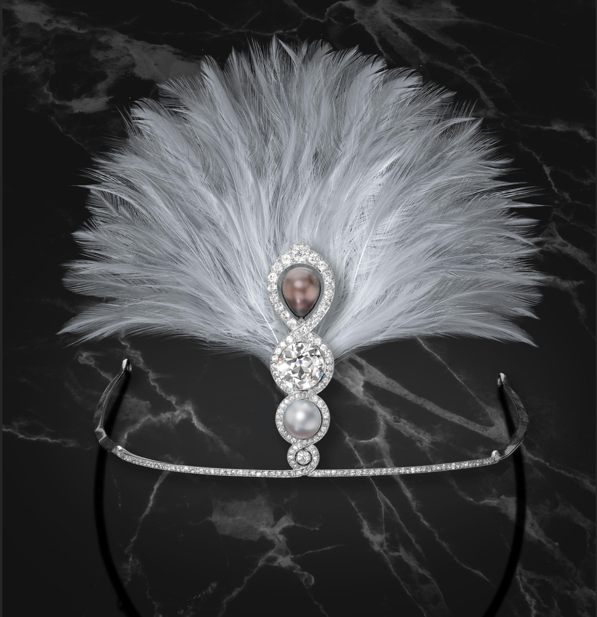 The large diamond is an 8.25ct European cut. The aigrette was made for sugar heiress Héléne Irwin Crocker Fagan. Diamond and natural pearl aigrette by Cartier, 1914. Sold by Bonhams, May 2022 for $586,275. 