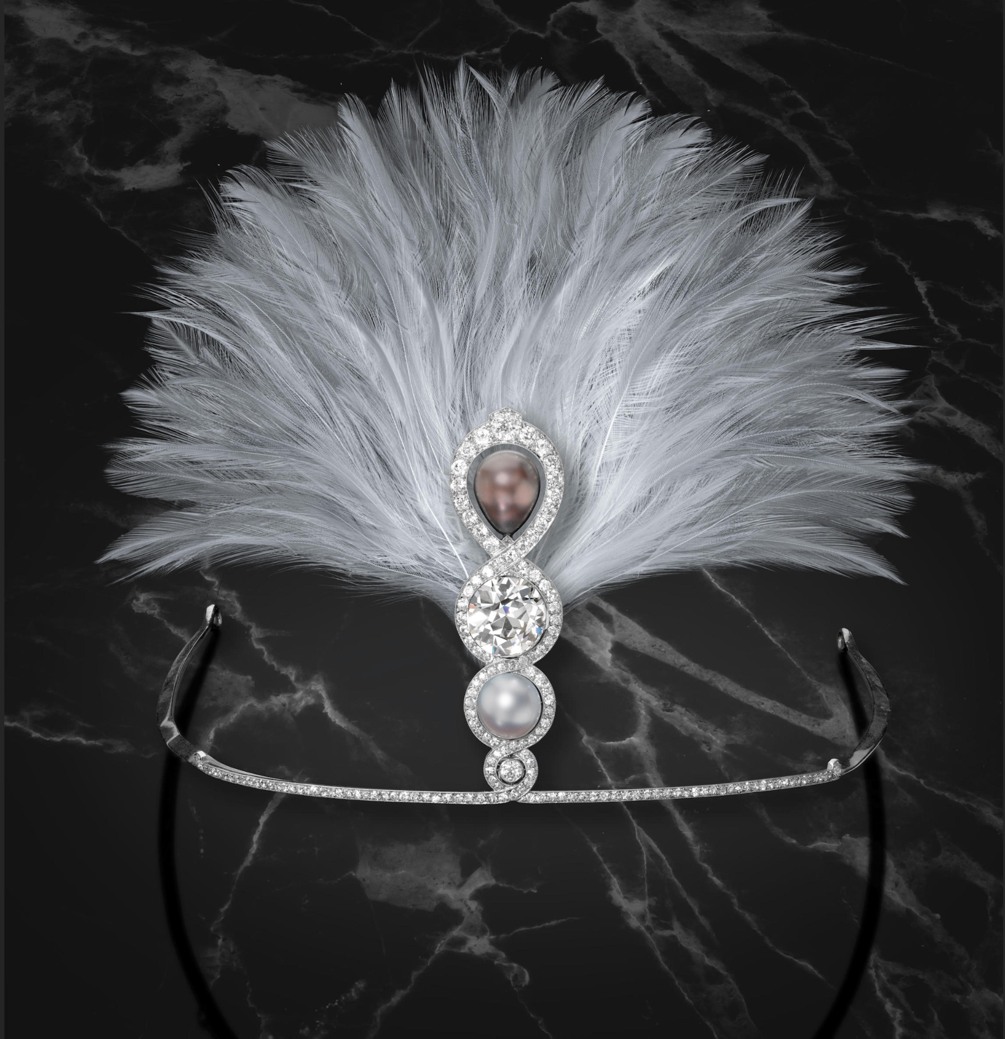 The large diamond is an 8.25ct European cut. The aigrette was made for sugar heiress Héléne Irwin Crocker Fagan. Diamond and natural pearl aigrette by Cartier, 1914. Sold by Bonhams, May 2022 for $586,275.