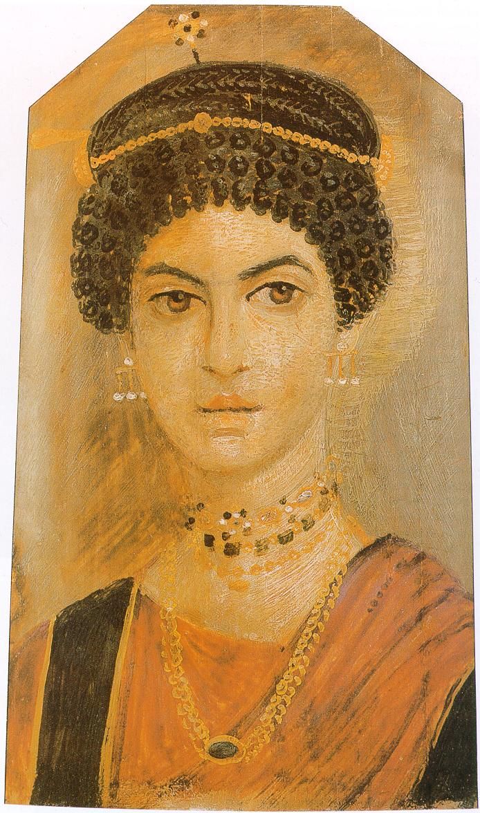 Mummy-portrait in encaustic waxes on a wooden panel, depicting a woman wearing a red tunic and elaborate jewellery, excavated by Petrie: Ancient Egyptian, Hawara, Middle Egypt, Roman Period, c. AD 110-130.
