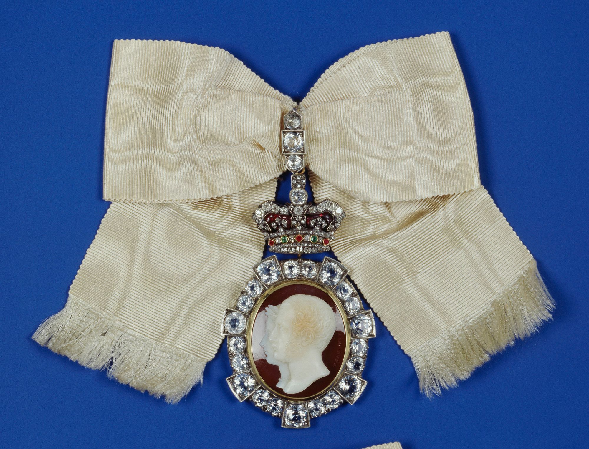 The jugate heads in this cameo are of Prince Albert and Queen Victoria. It was a gift to mark the confirmation gift for the couple's eldest daughter in 1856. It was repeated as a gift for their second daughter Alice, three years later. 