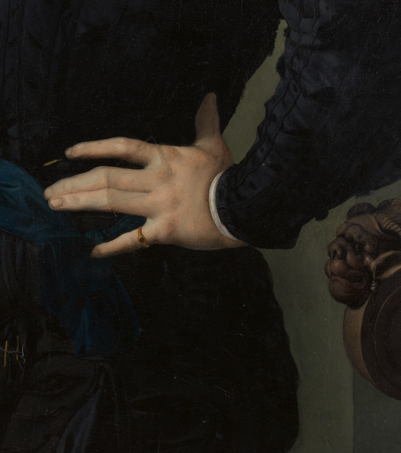 Detail from Portrait of a Young Man by Bronzino, 1530s. 