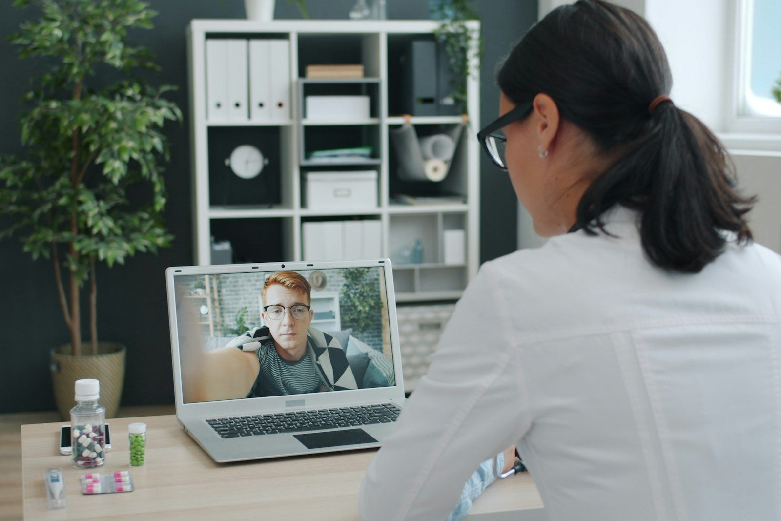 Clinician speaking to a patient on a video call
