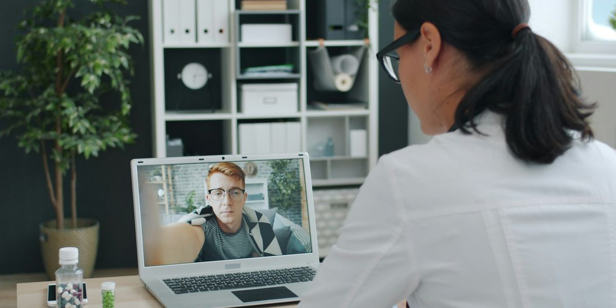 Clinician speaking to a patient on a video call
