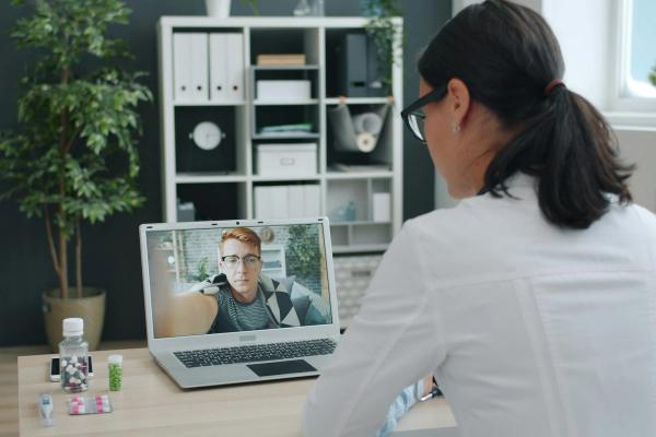Clinician speaking to a patient on a video call