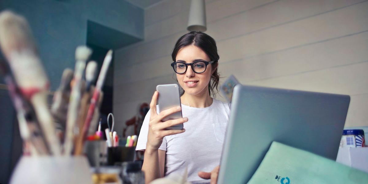 Person at a laptop reading about weight loss treatment options