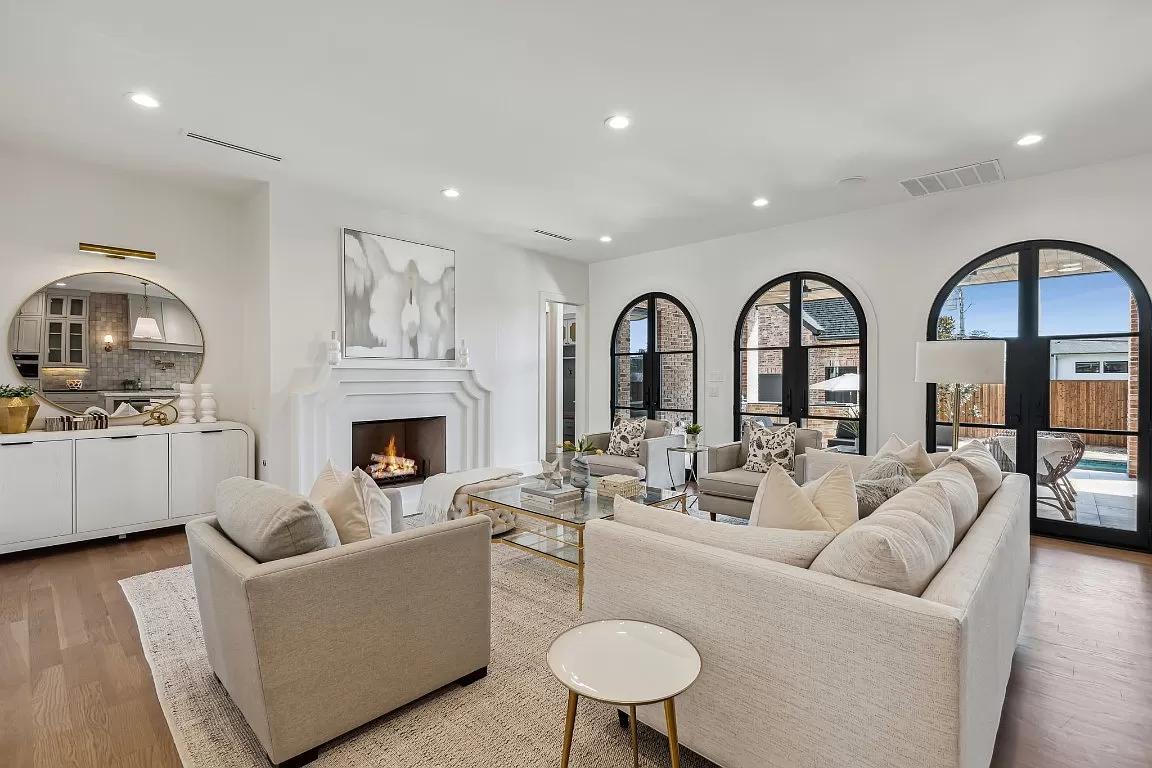 Luxury staged living room with arched windows