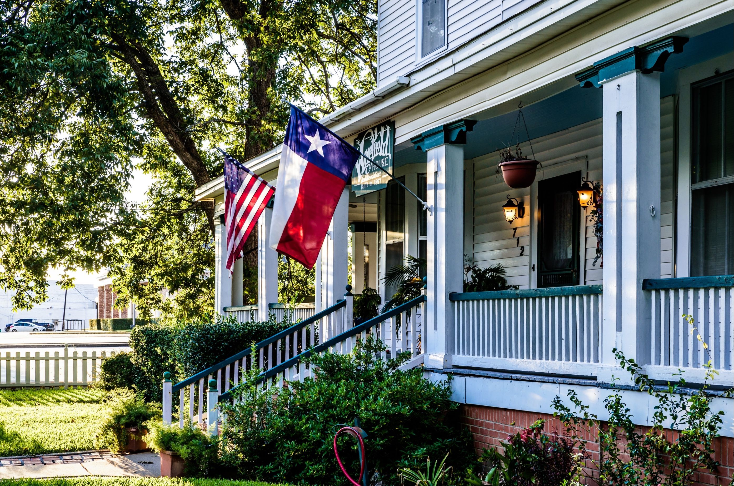 Texas home with front porch and flag