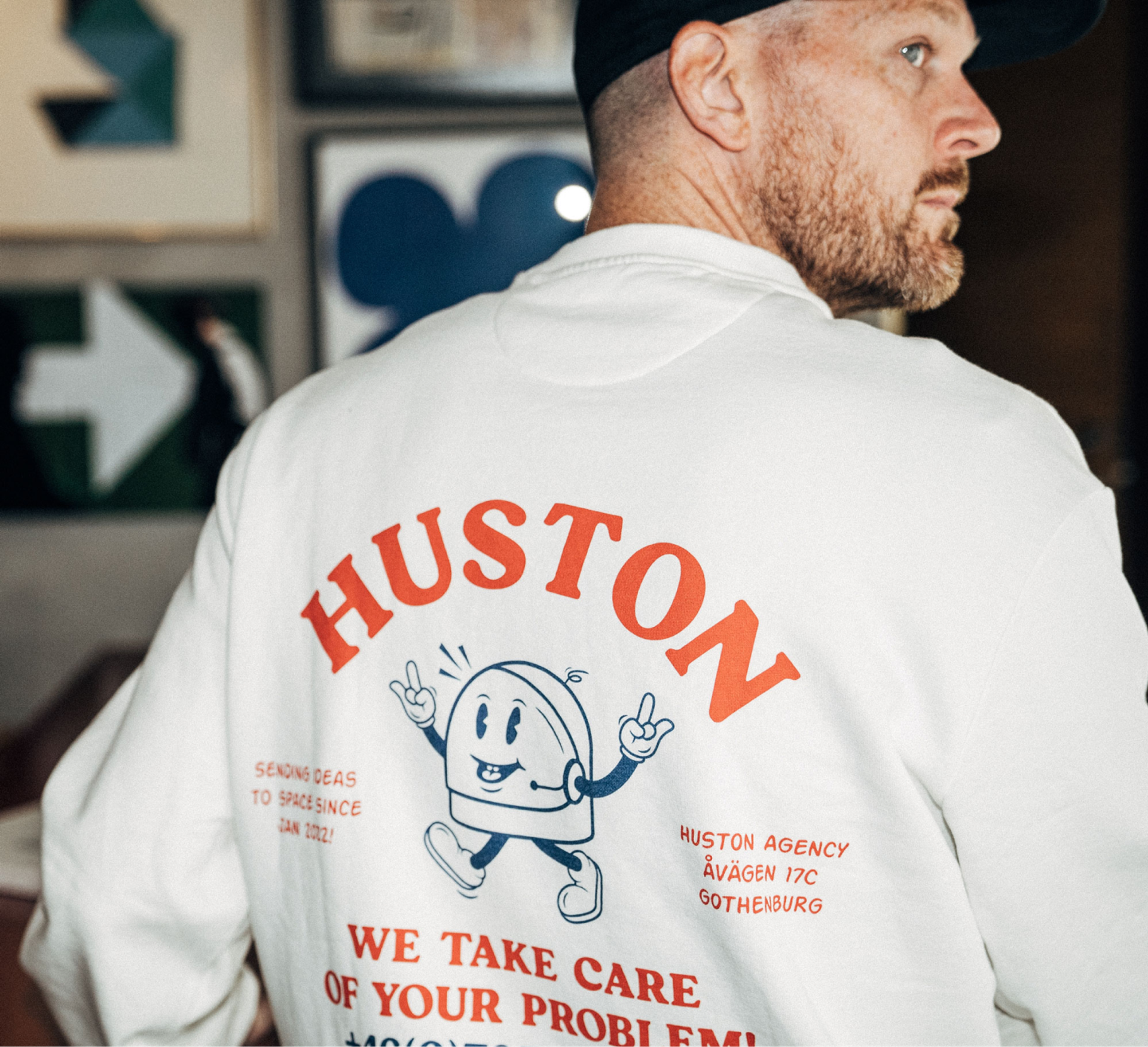 A picture showing the reverse print of a piece of Creator Studio merch