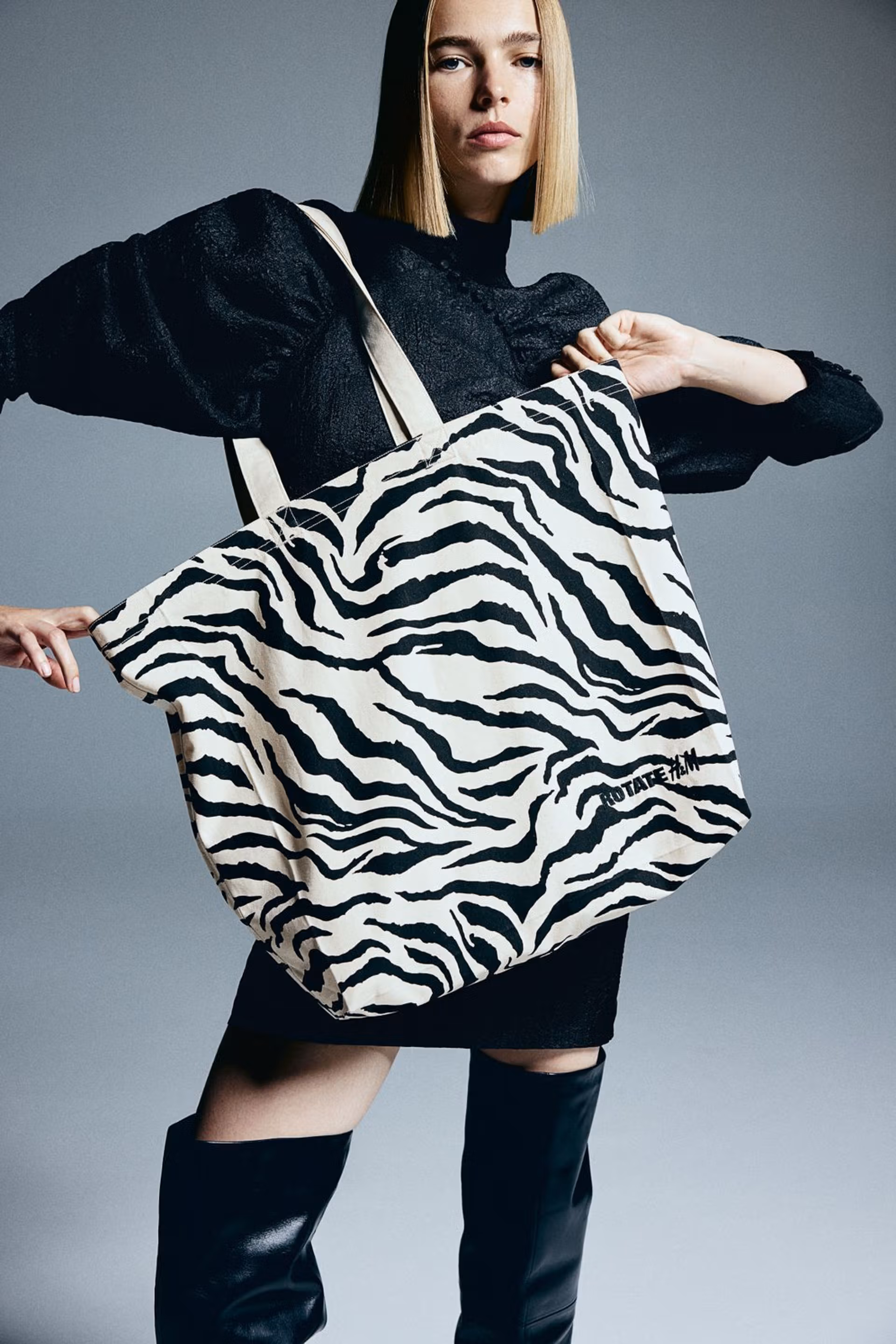 A female model carrying a custom made canvas tote bag