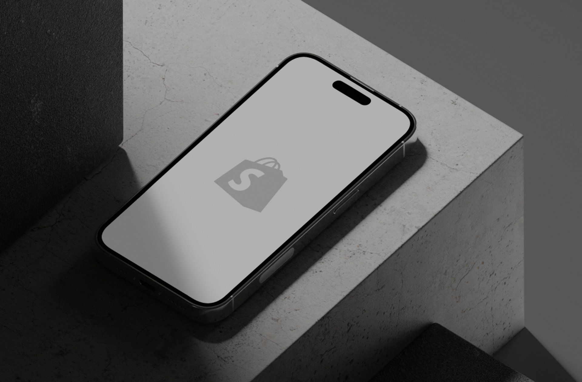 A phone showing a Shopify logo