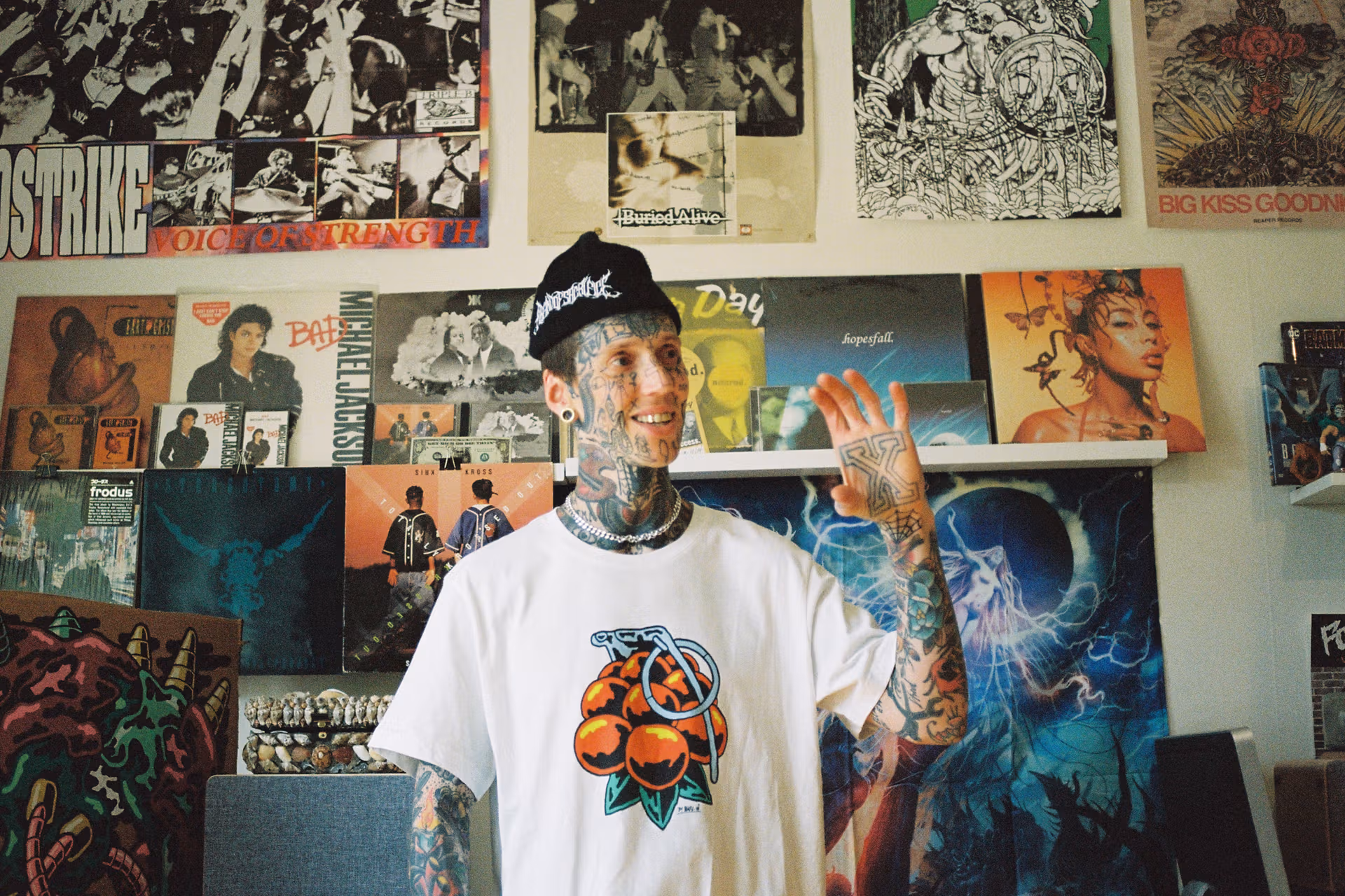 A creator / customer wearing a custom white tee produced by Creator Studio