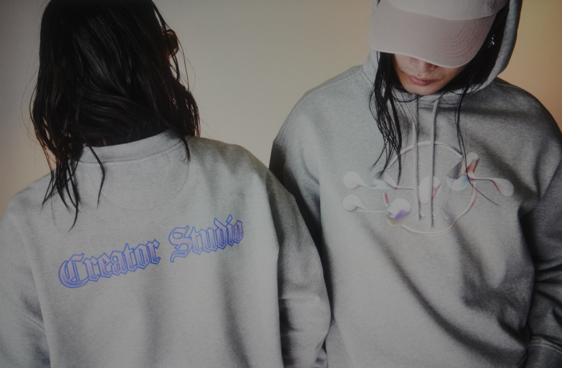 Two girls wear Creator Studio custom printed hoodies