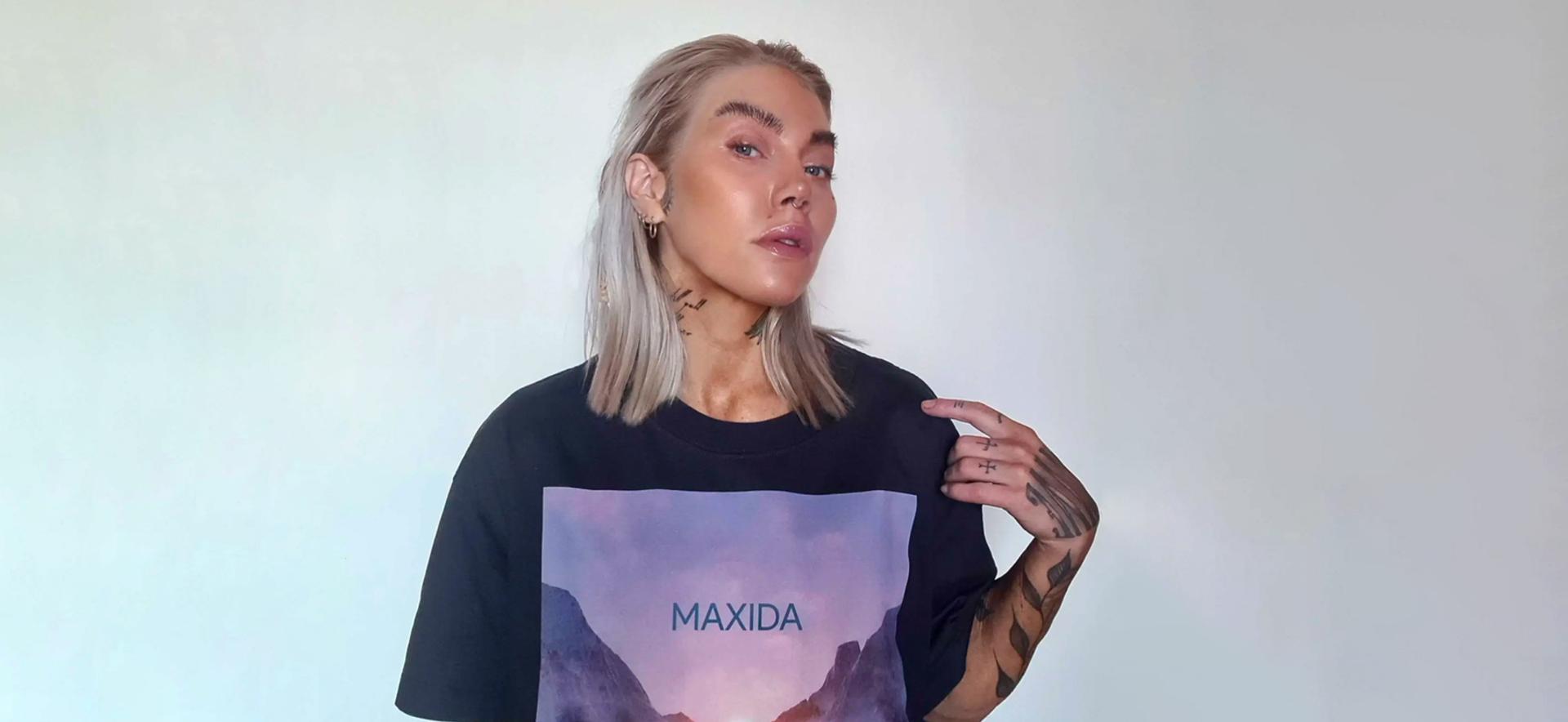 Maxida Märak stands proud in her own merch. A strong, powerful, charismatic performer and activist, she champions the rights of the Sámi people.