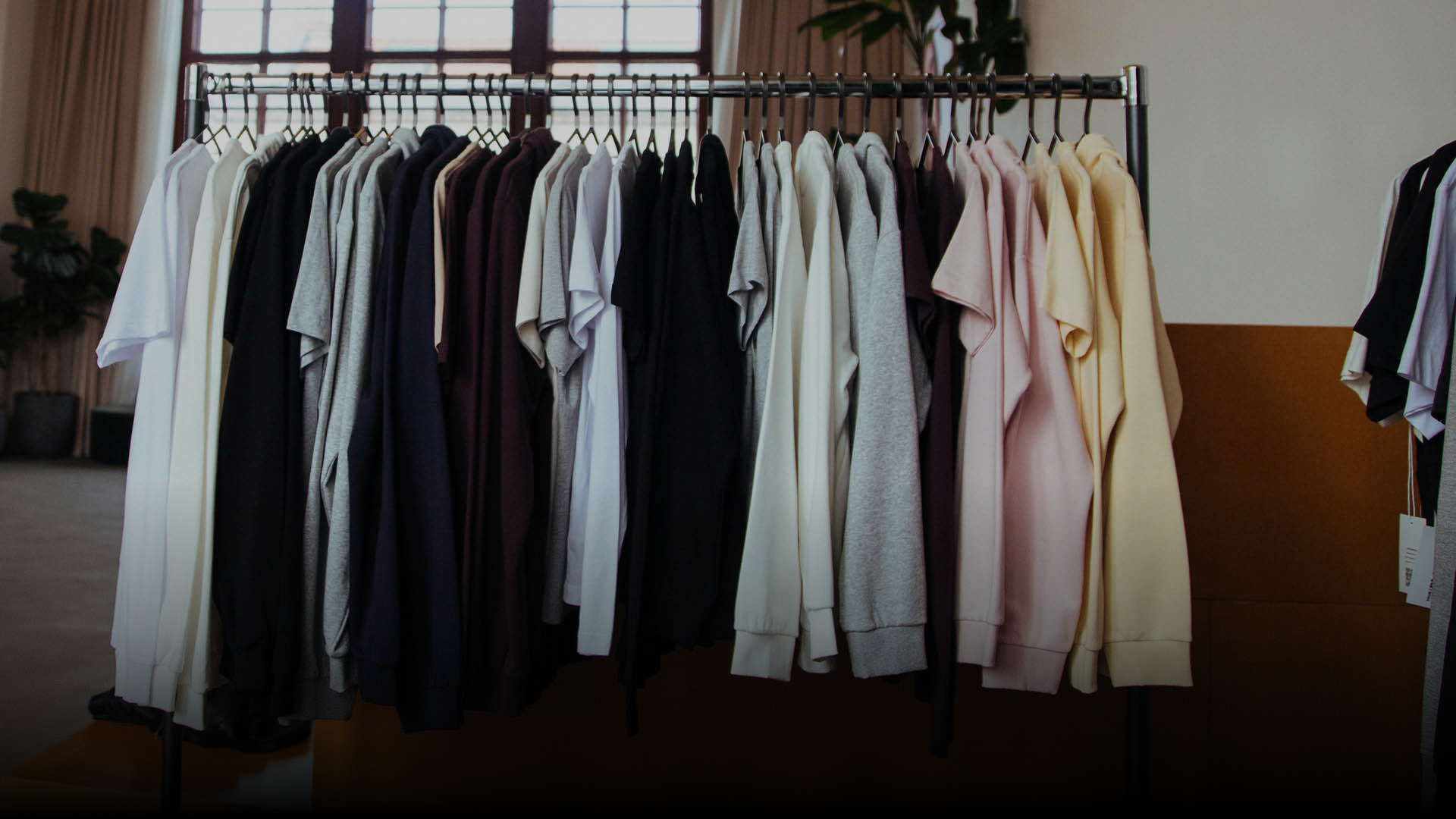 A row of custom print on demand garments from Creator Studio