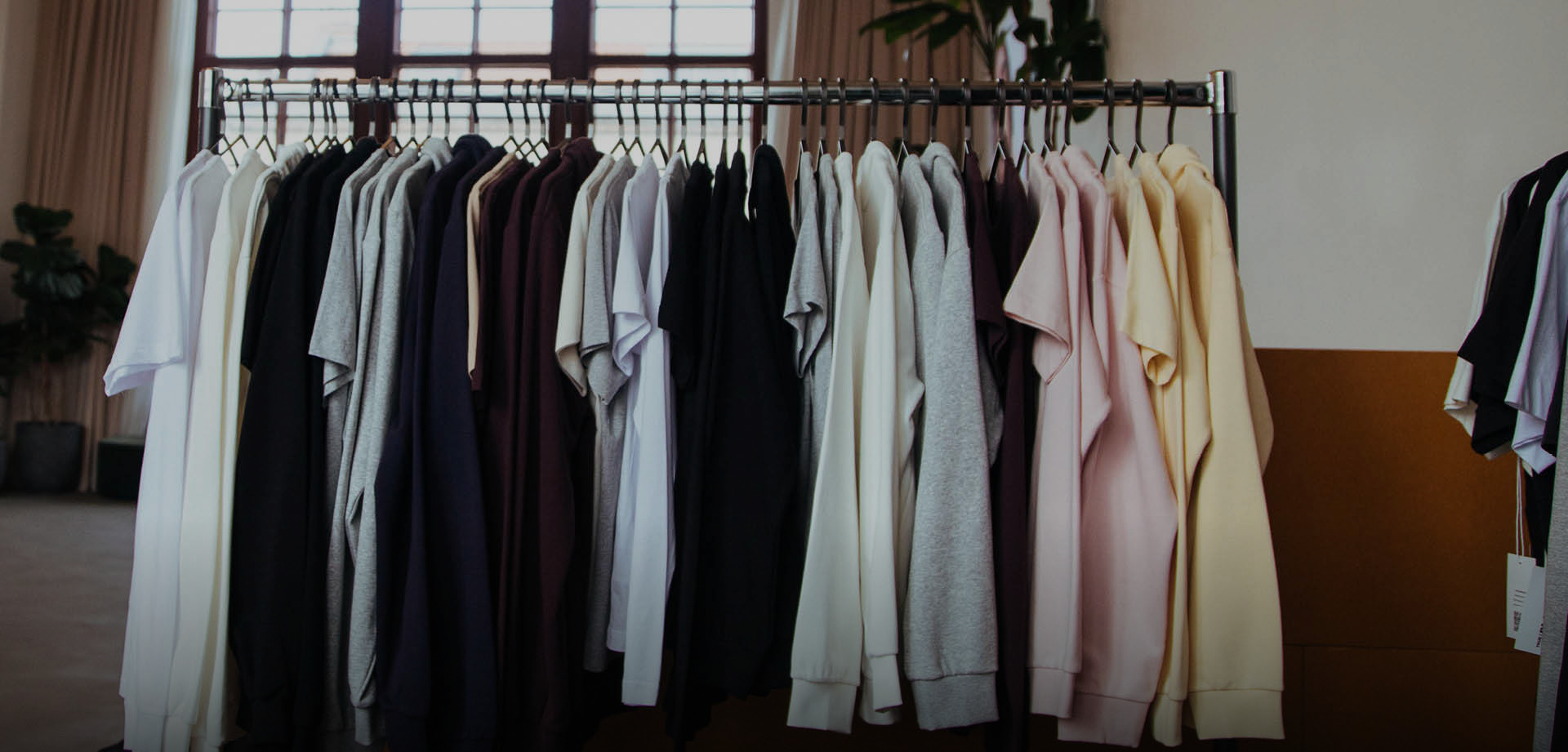 A row of custom print on demand garments from Creator Studio