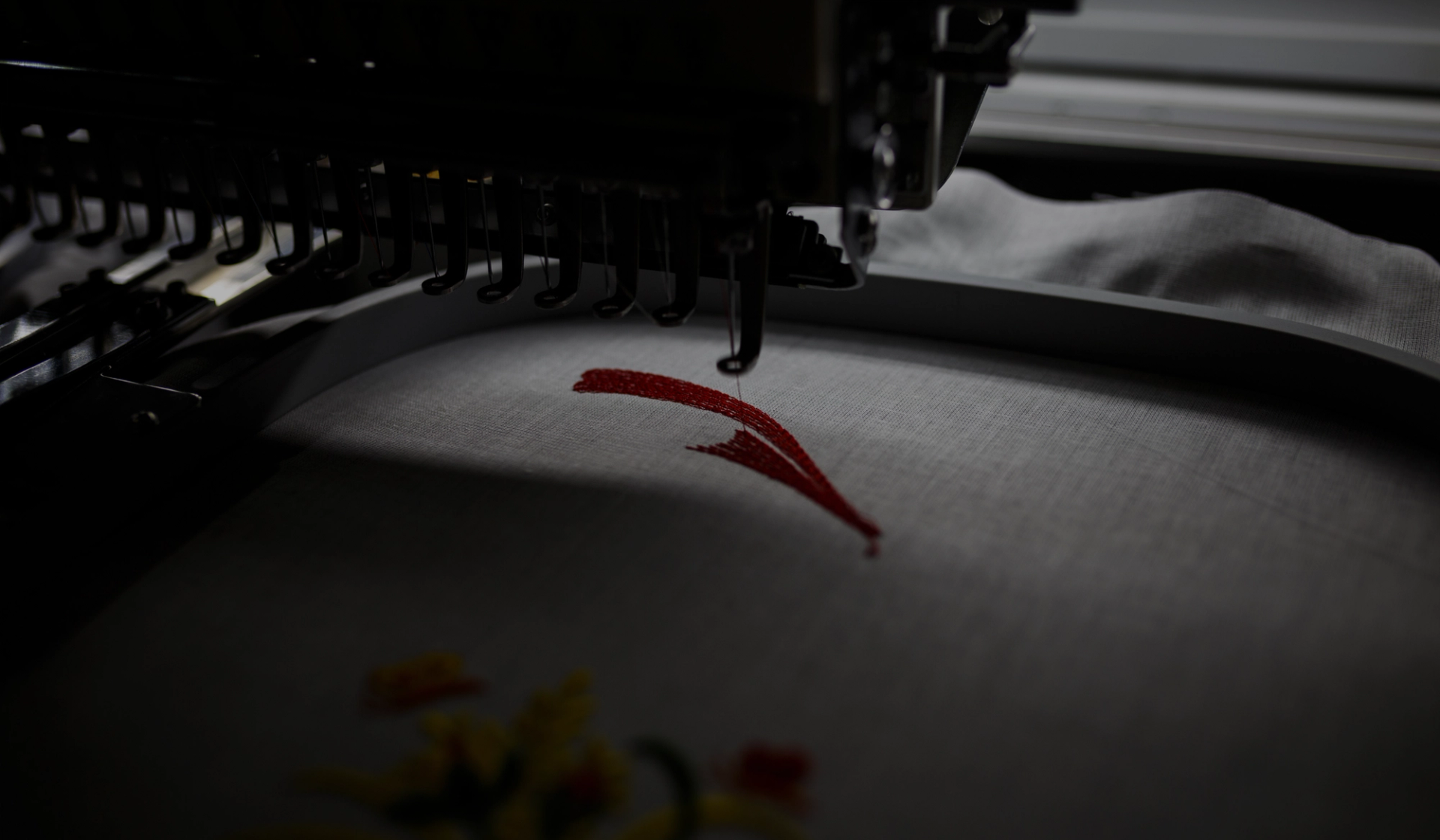 A t-shirt being embroidered by Creator Studio machines