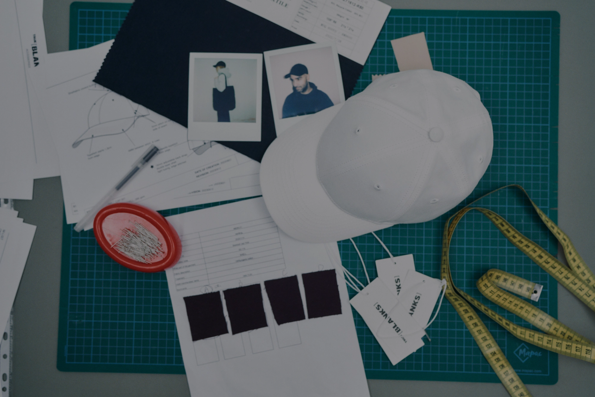 sketches and lab dips, together with a twill baseball caps and polaroids from fitting 