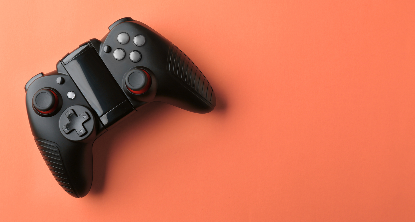 Controle de videogame em um fundo laranja