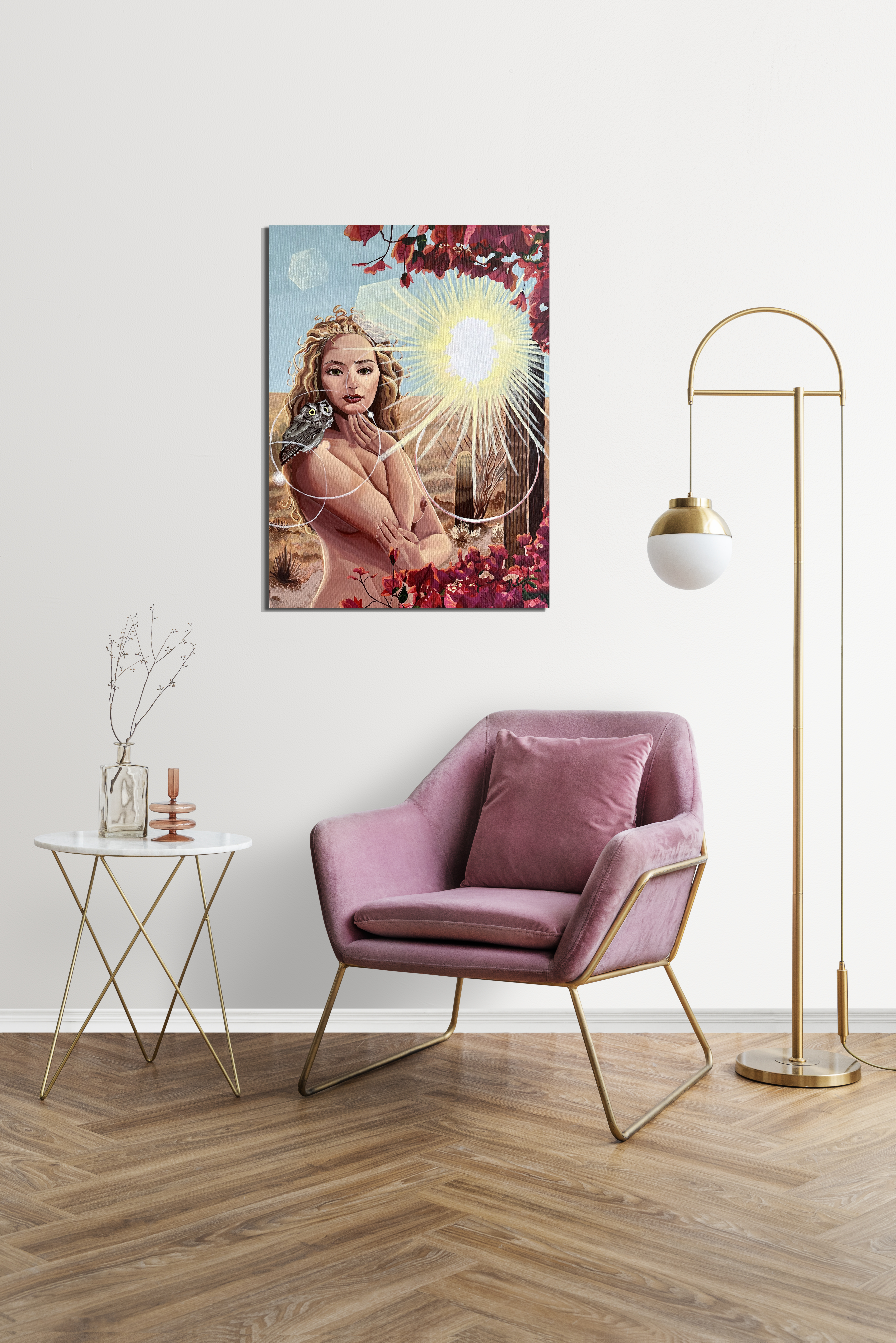 Painting of a woman with an owl on her shoulder. Desert cactus fill the background as well as a sunburst, bringing a glow to all around it. Bougainvillea surround her. 