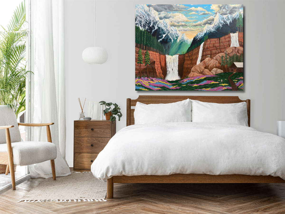 Original landscape painting of mountains and waterfalls displayed in a bright bedroom.