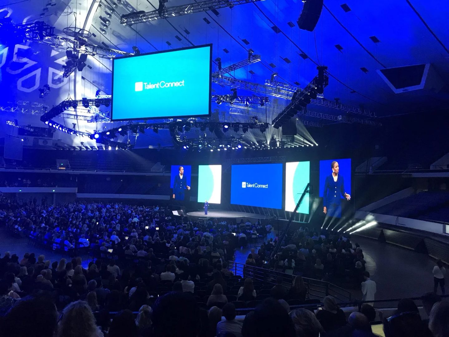 A brand identity applied at scale across stage and screen at a conference keynote.