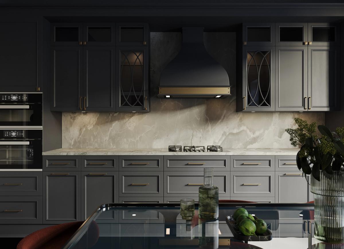 A bespoke charcoal kitchen with marble worktops and brass detailing in a refurbished home.