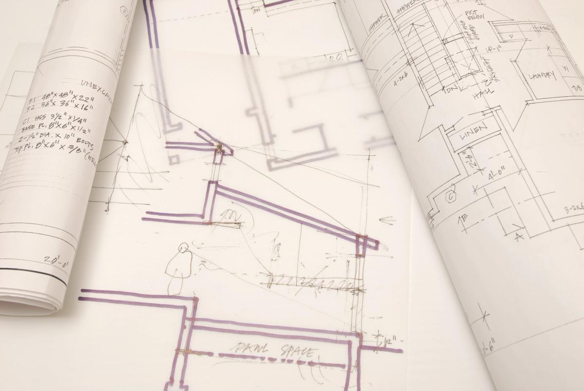Construction drawings marked up with structural details, working through design and buildability.