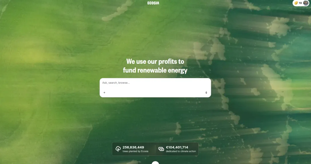 Ecosia search engine homepage with text We use our profits to fund renewable energy and search bar, plus statistics on trees planted and climate action