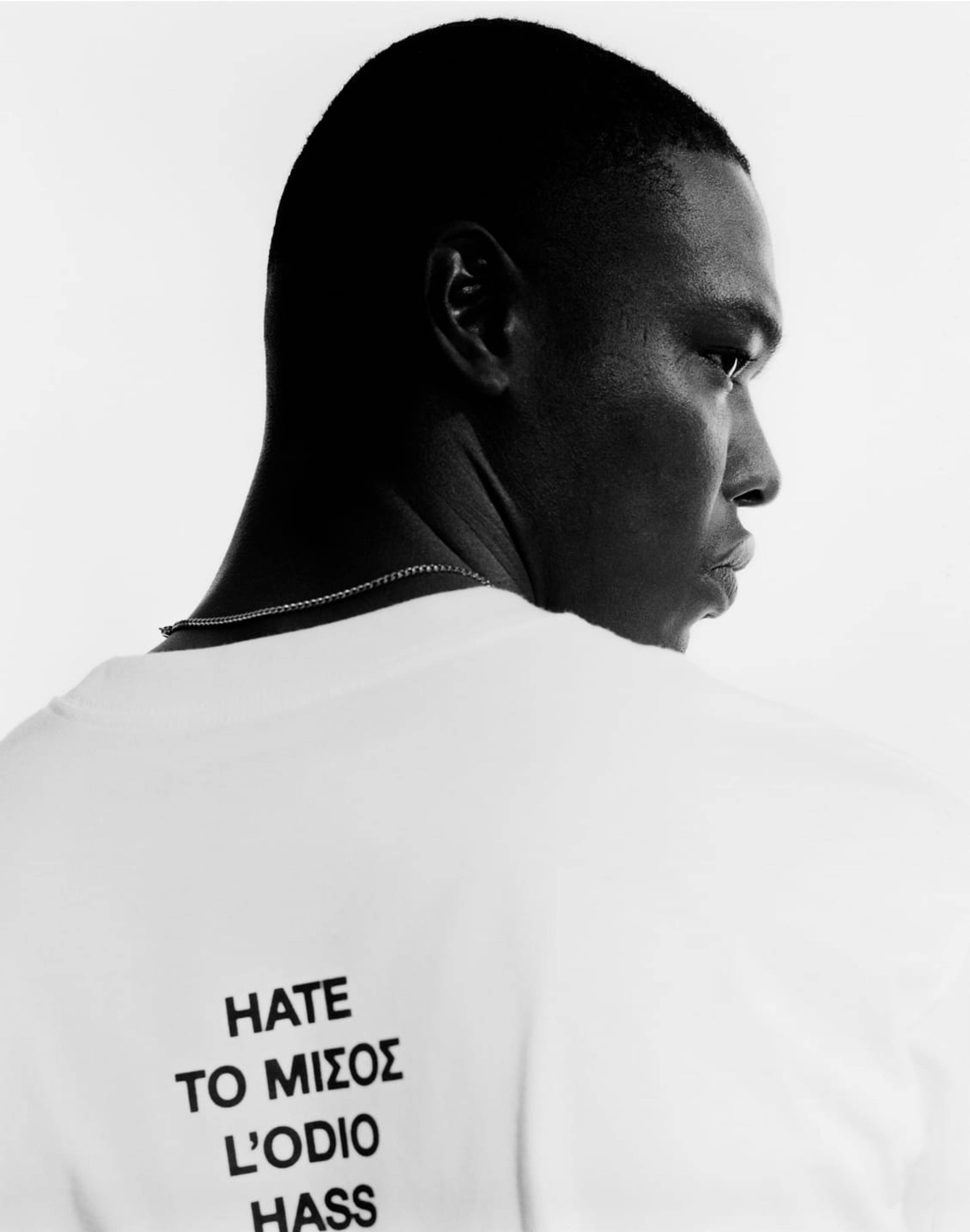 Model wearing white Carhartt WIP x La Haine 25th Anniversary T-shirt