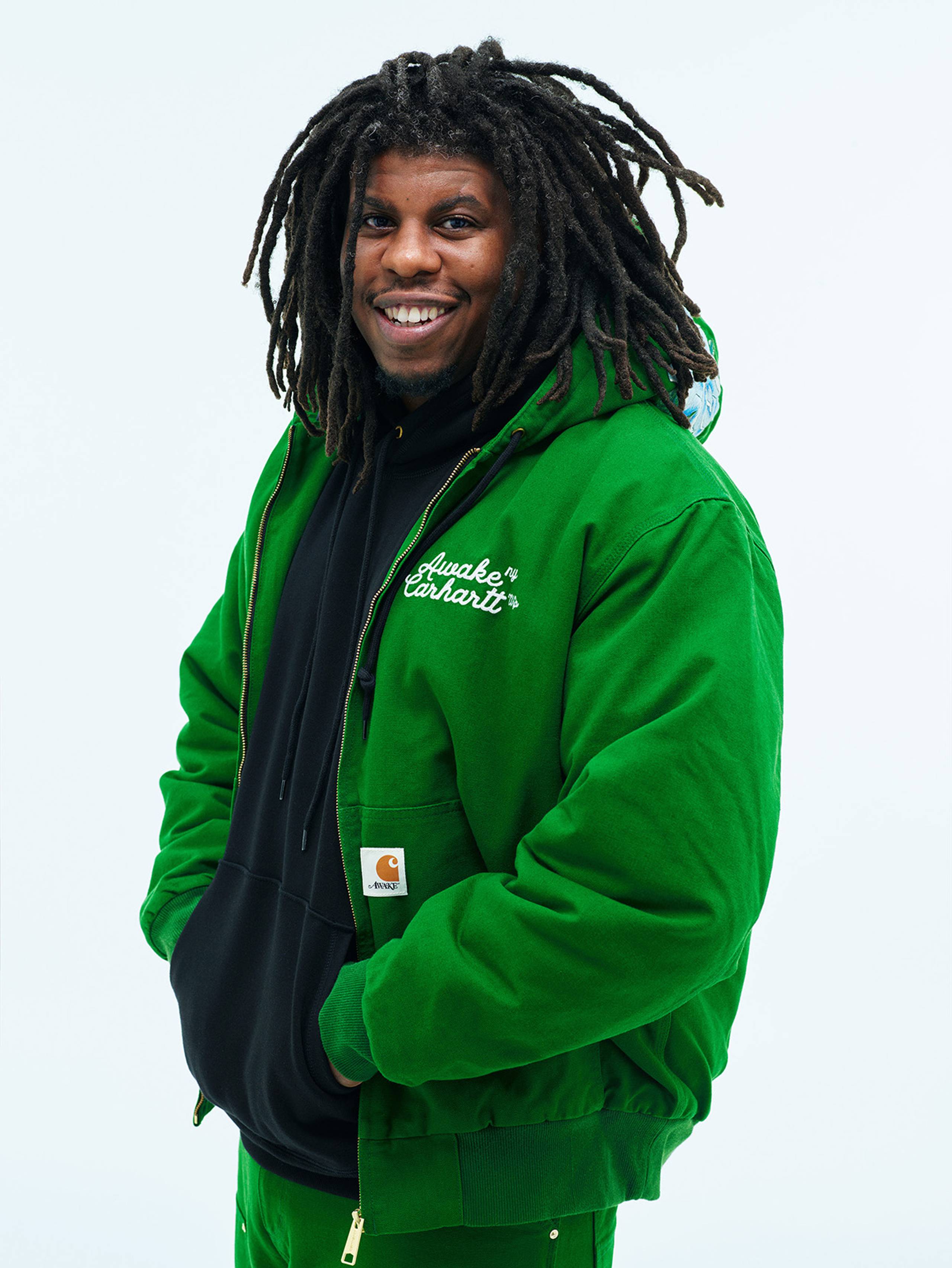 Model wearing Carhartt WIP x Awake NY OG Active Jacket in Green