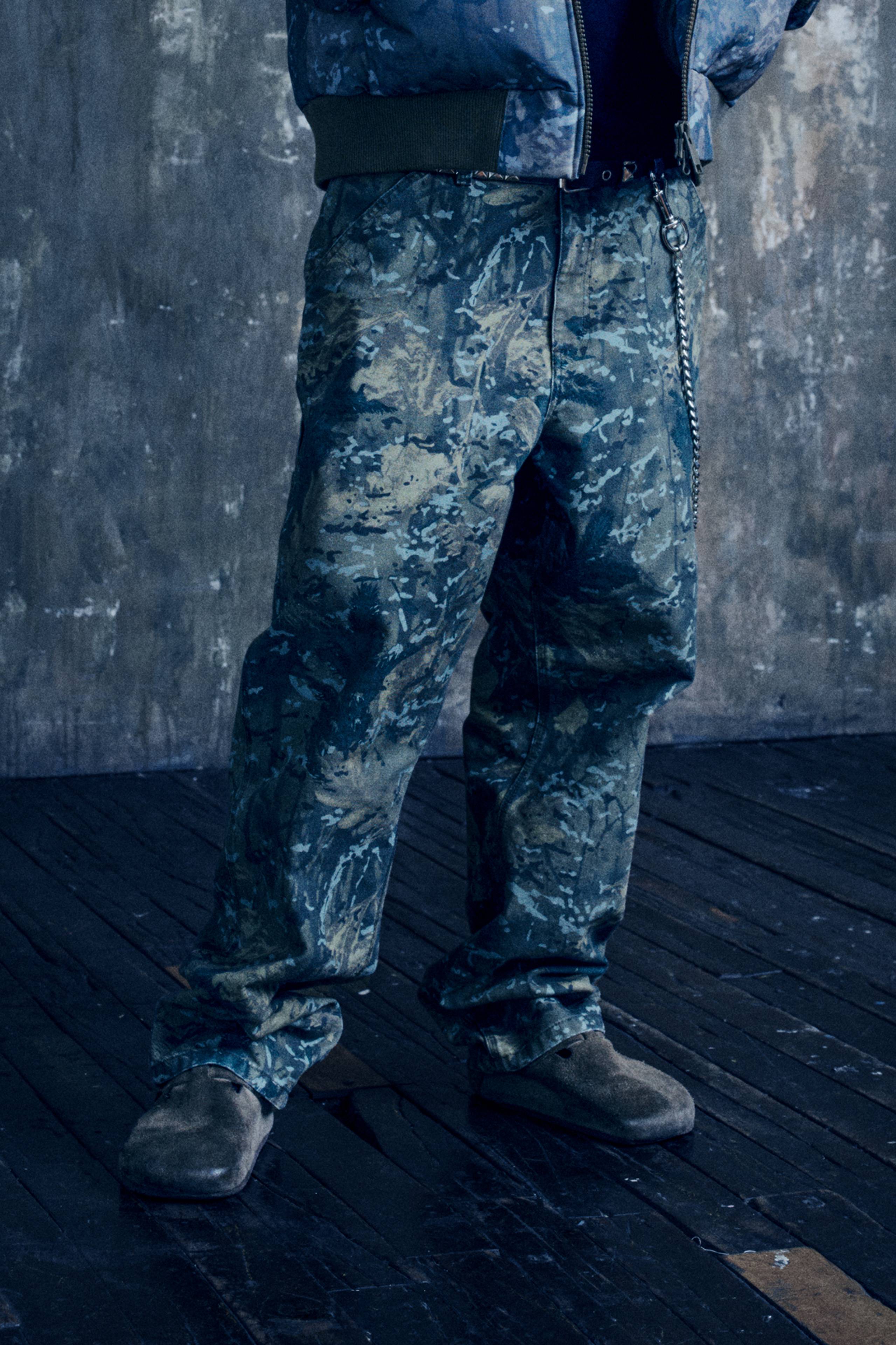 Model wearing a full Camo Combi look from the In Plain Sight Collection