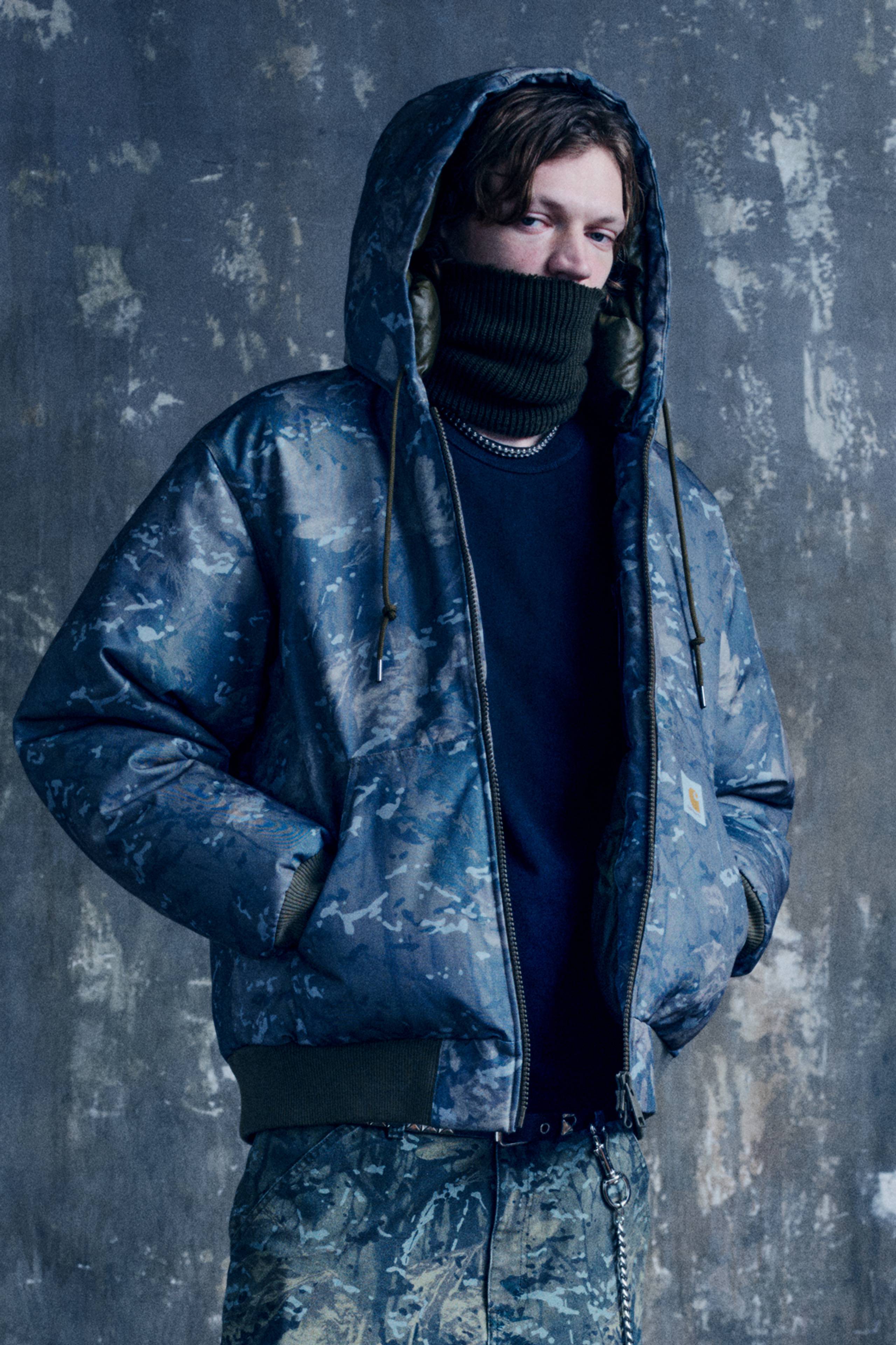 Model wearing a full Camo Combi look from the In Plain Sight Collection