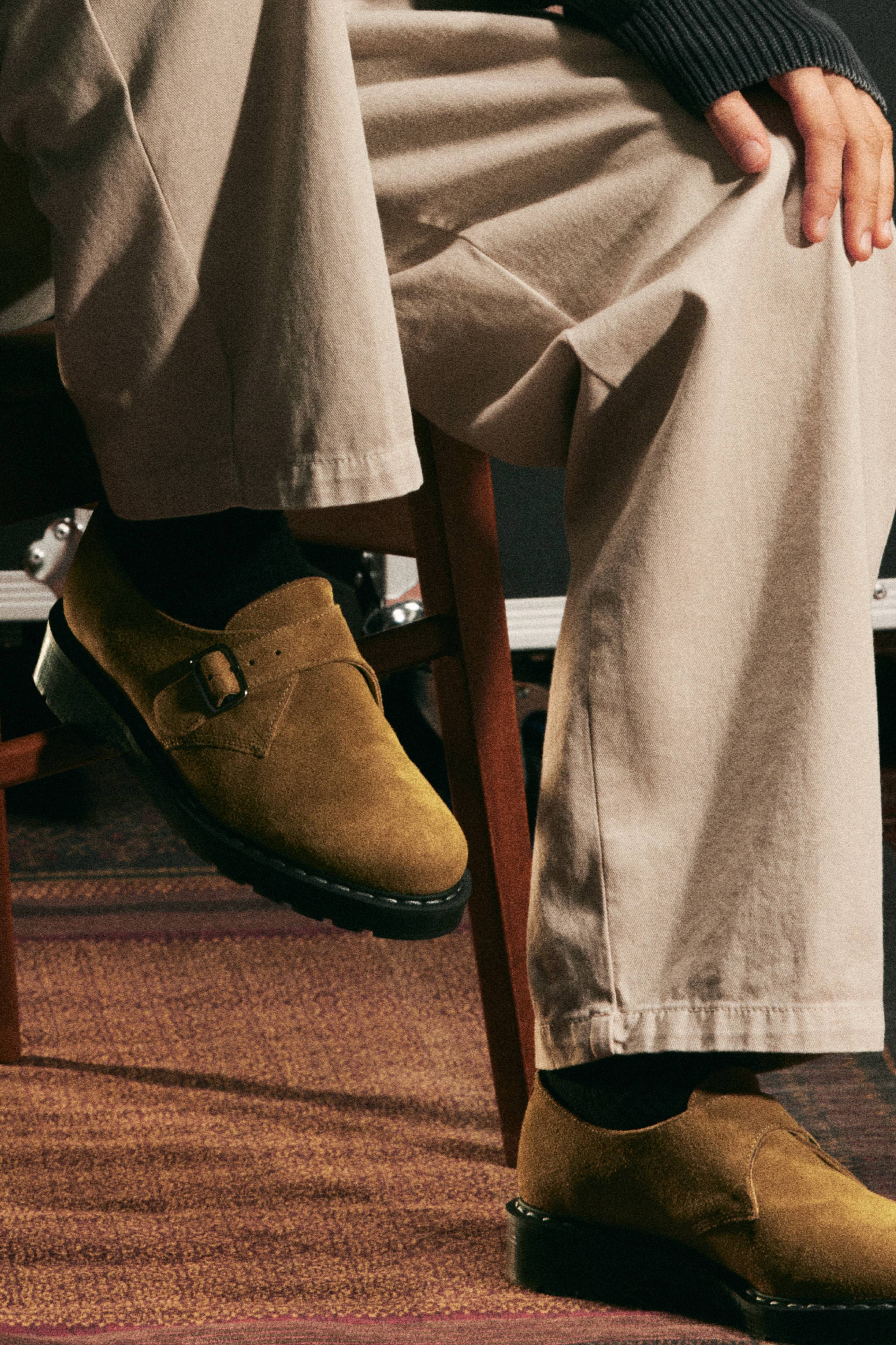 Model wearing a pair of the Solovair x Carhartt WIP Collaboration Monk Strap Derbies