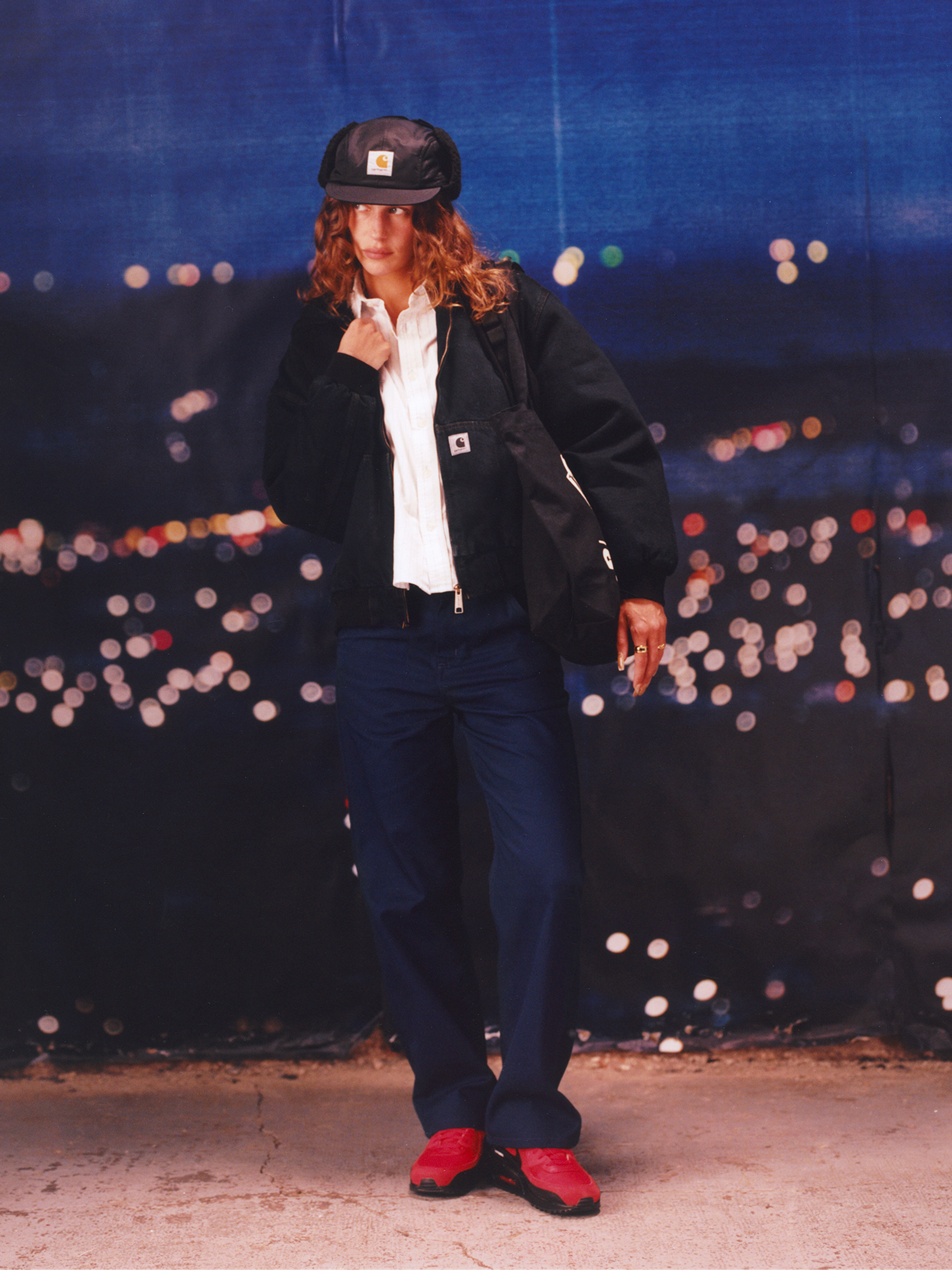 Model wearing a black Active Jacket in the Carhartt WIP F/W25 Women's Lookbook