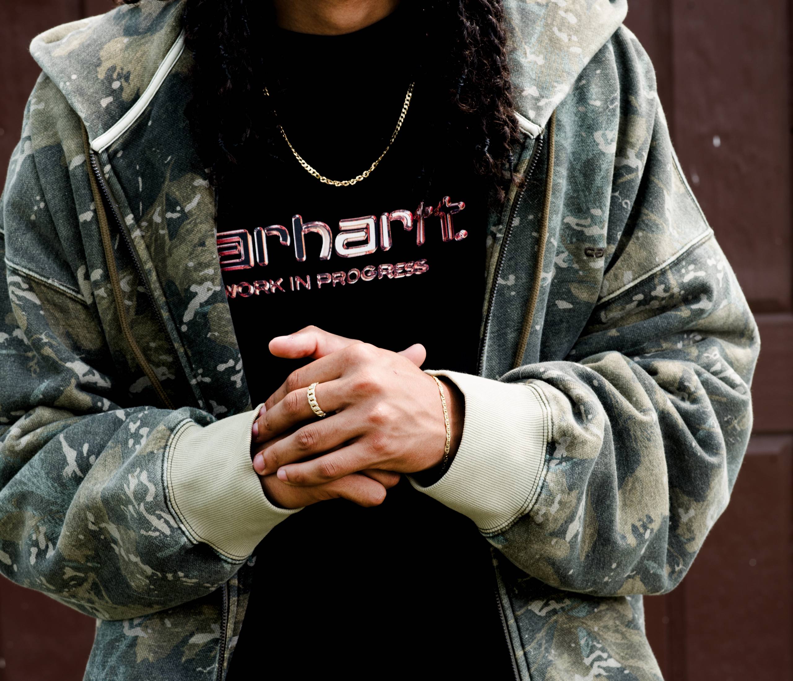 Model wearing a Hooded Benton Sweatshirt in Green Camo Combi