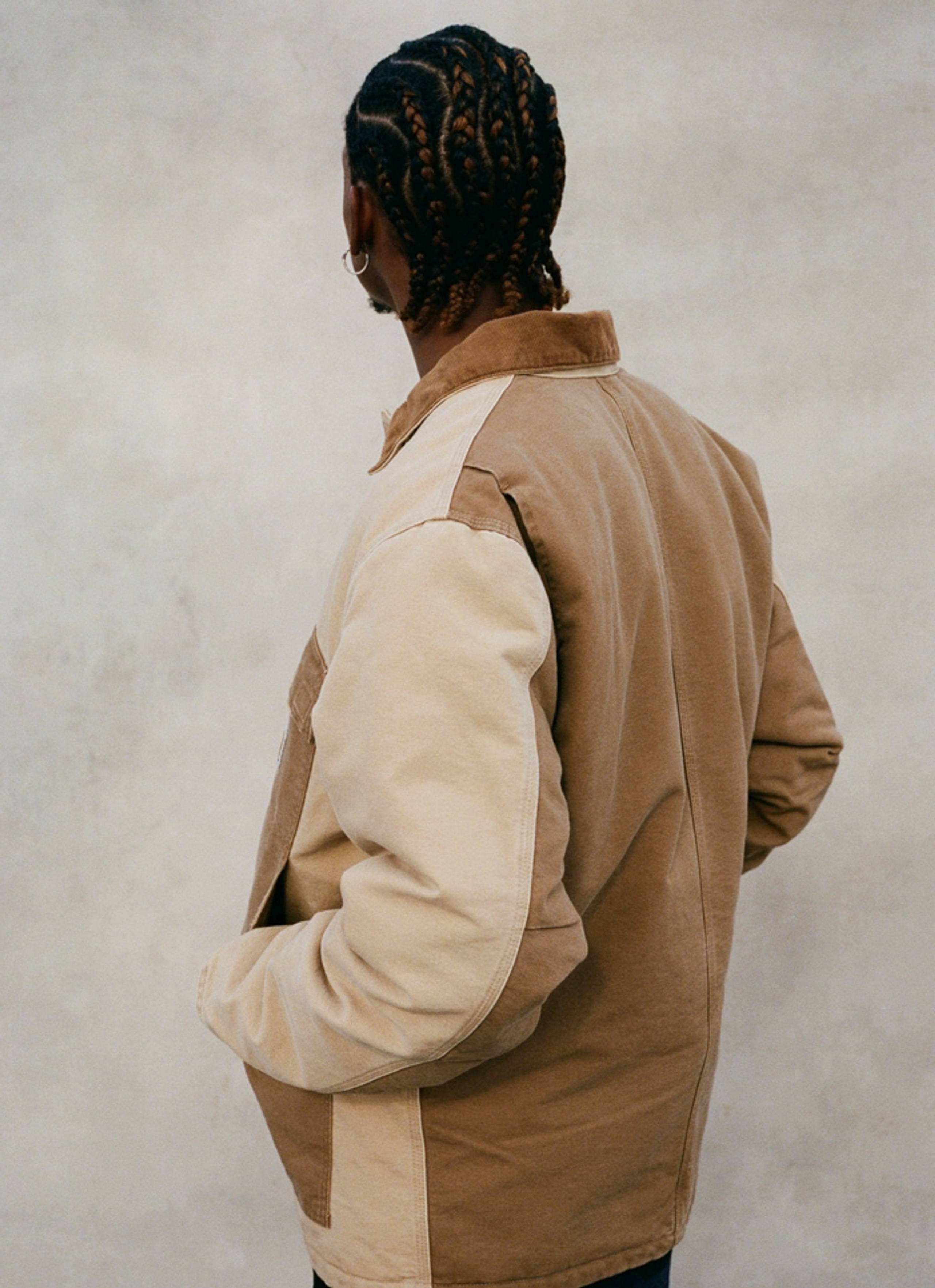Model wearing Carhartt WIP OG Arctic Jacket in Two-Tone Dusty Hamilton Brown reworked fabric