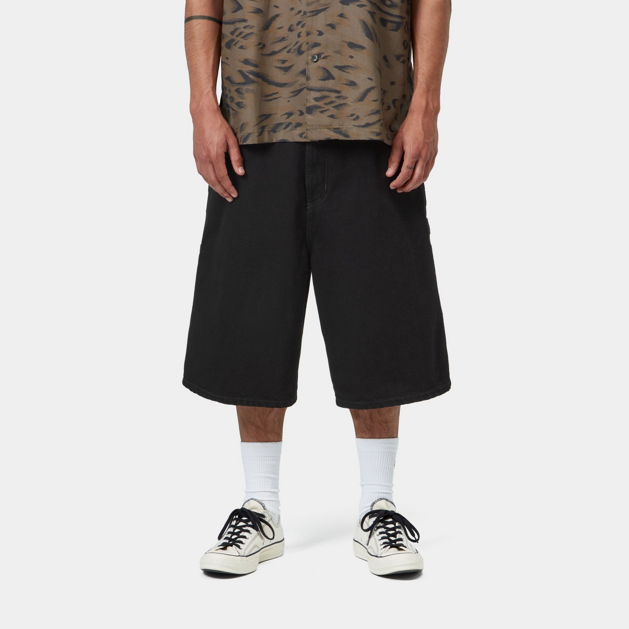 Model wearing a pair of OG Single Knee Shorts in Black
