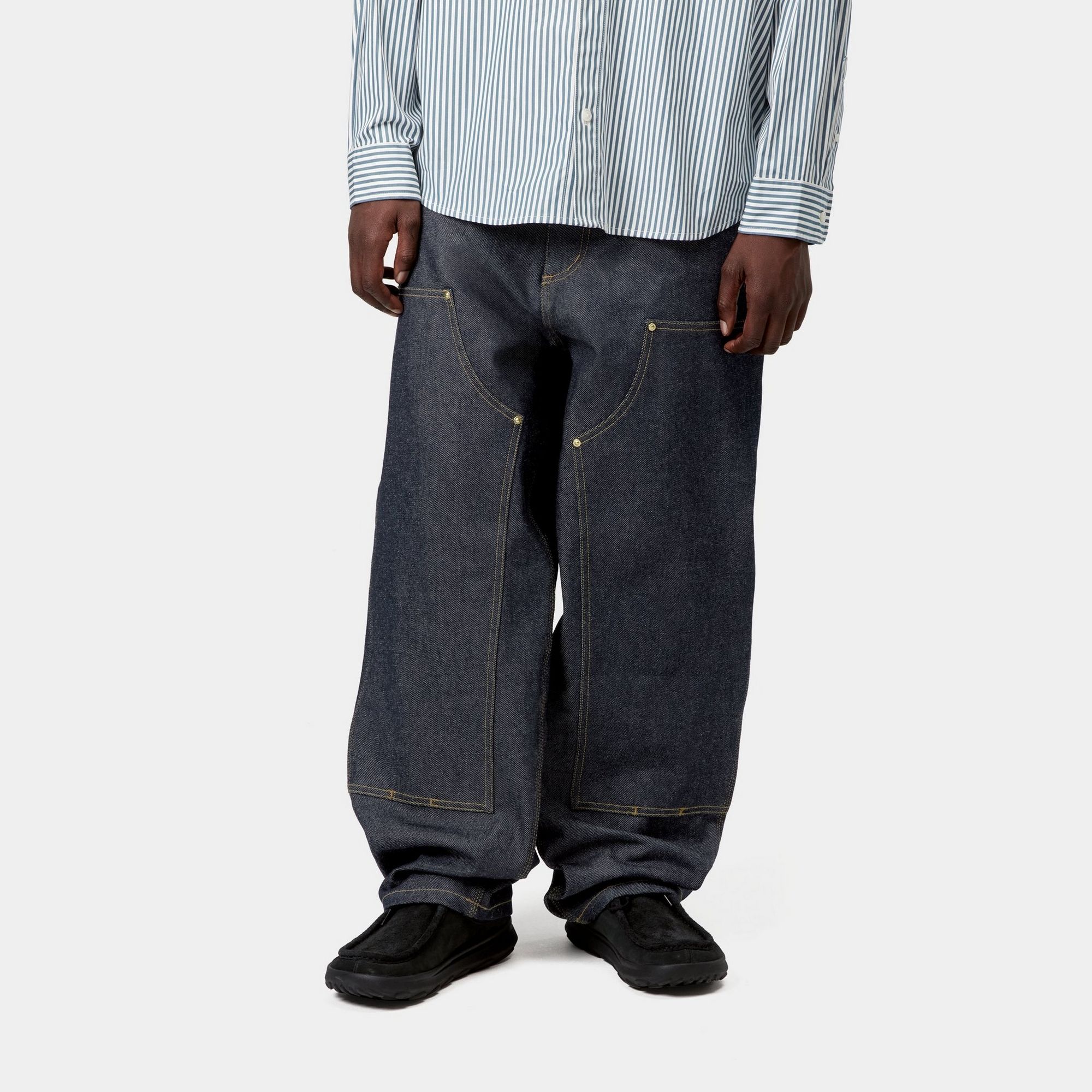 Model wearing a pair of OG Double Knee Pant - Bradenton Denim in Blue Rigid