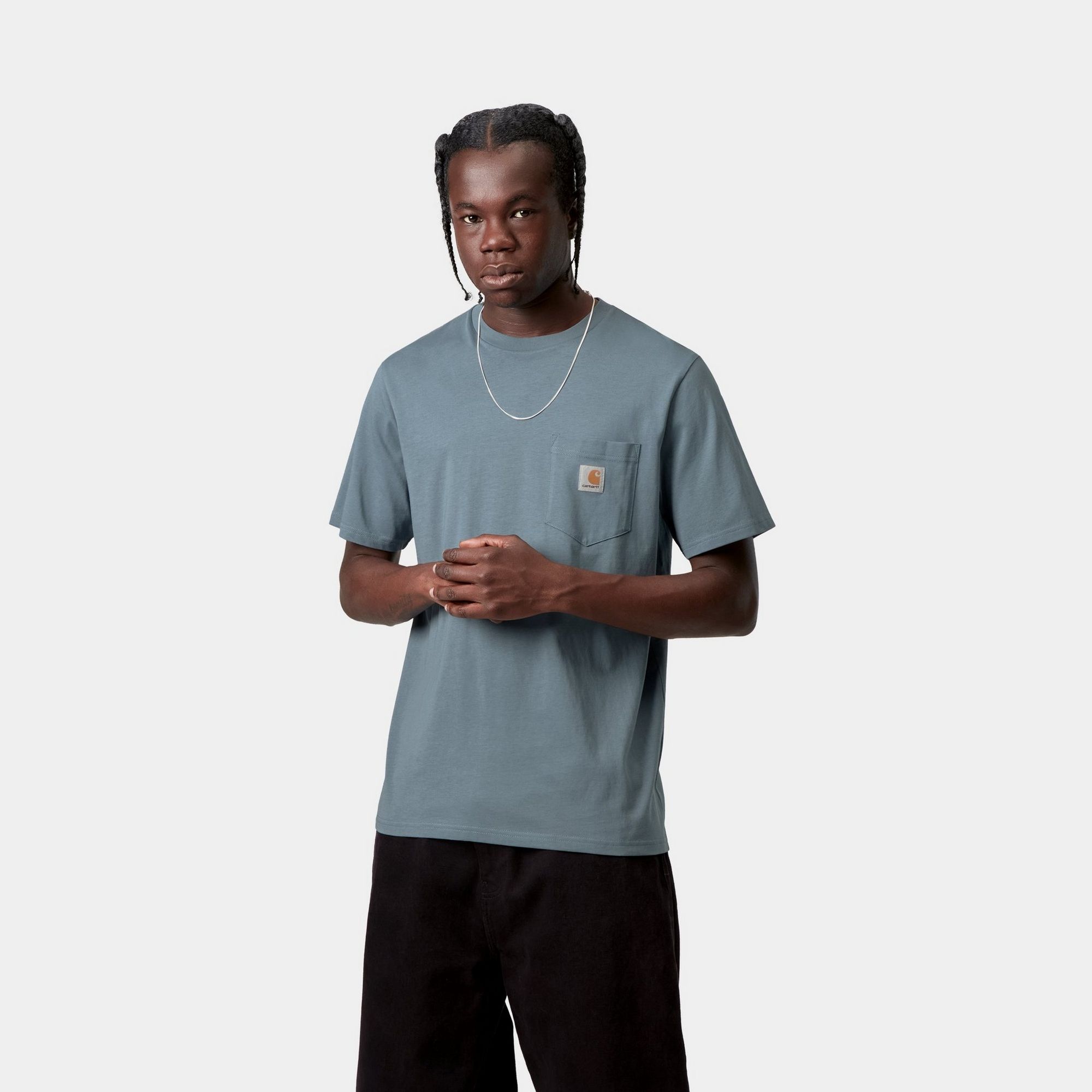 Model wearing a Pocket T-Shirt in Velvet Blue