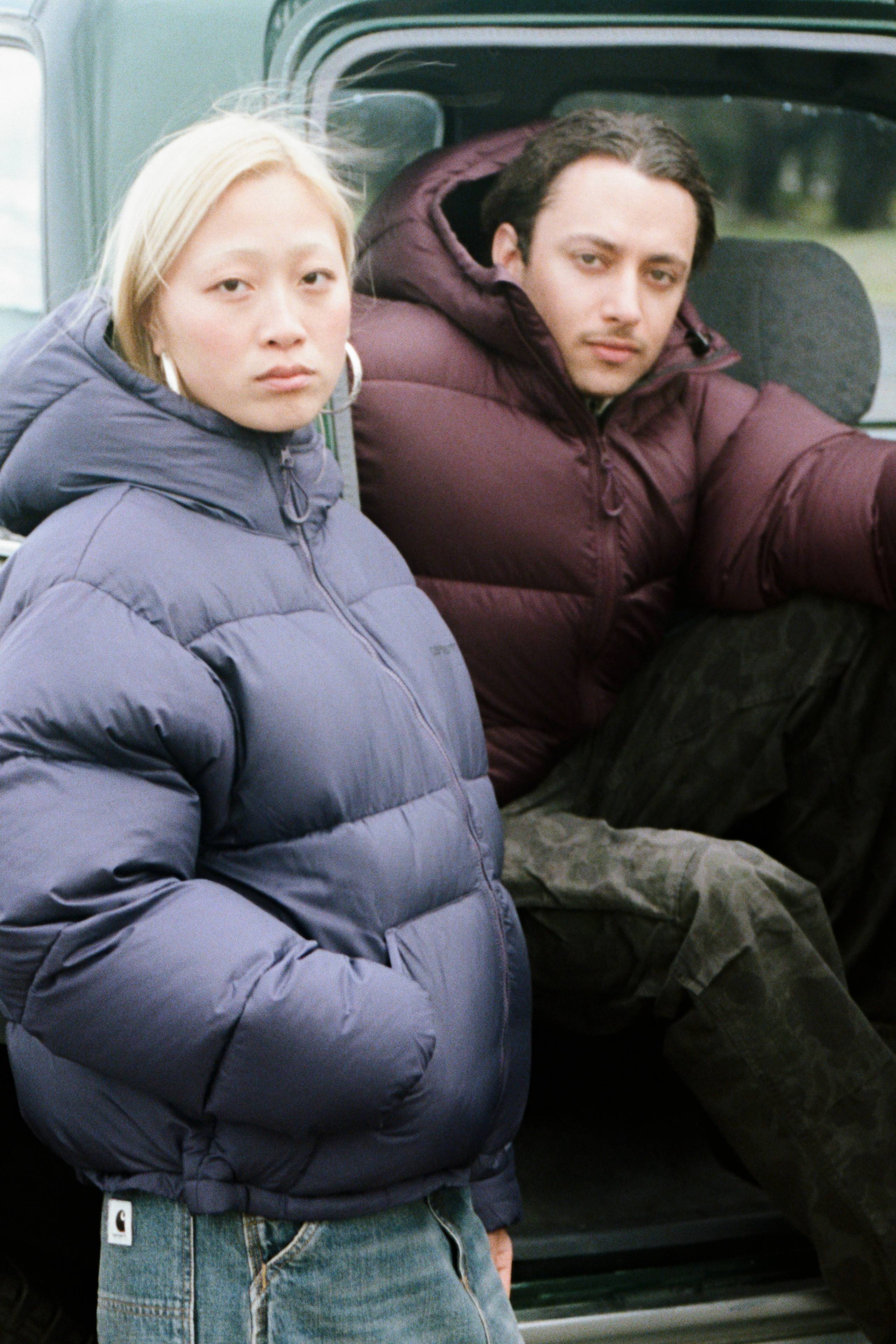 Models wearing a Toronto Jacket sitting in a car